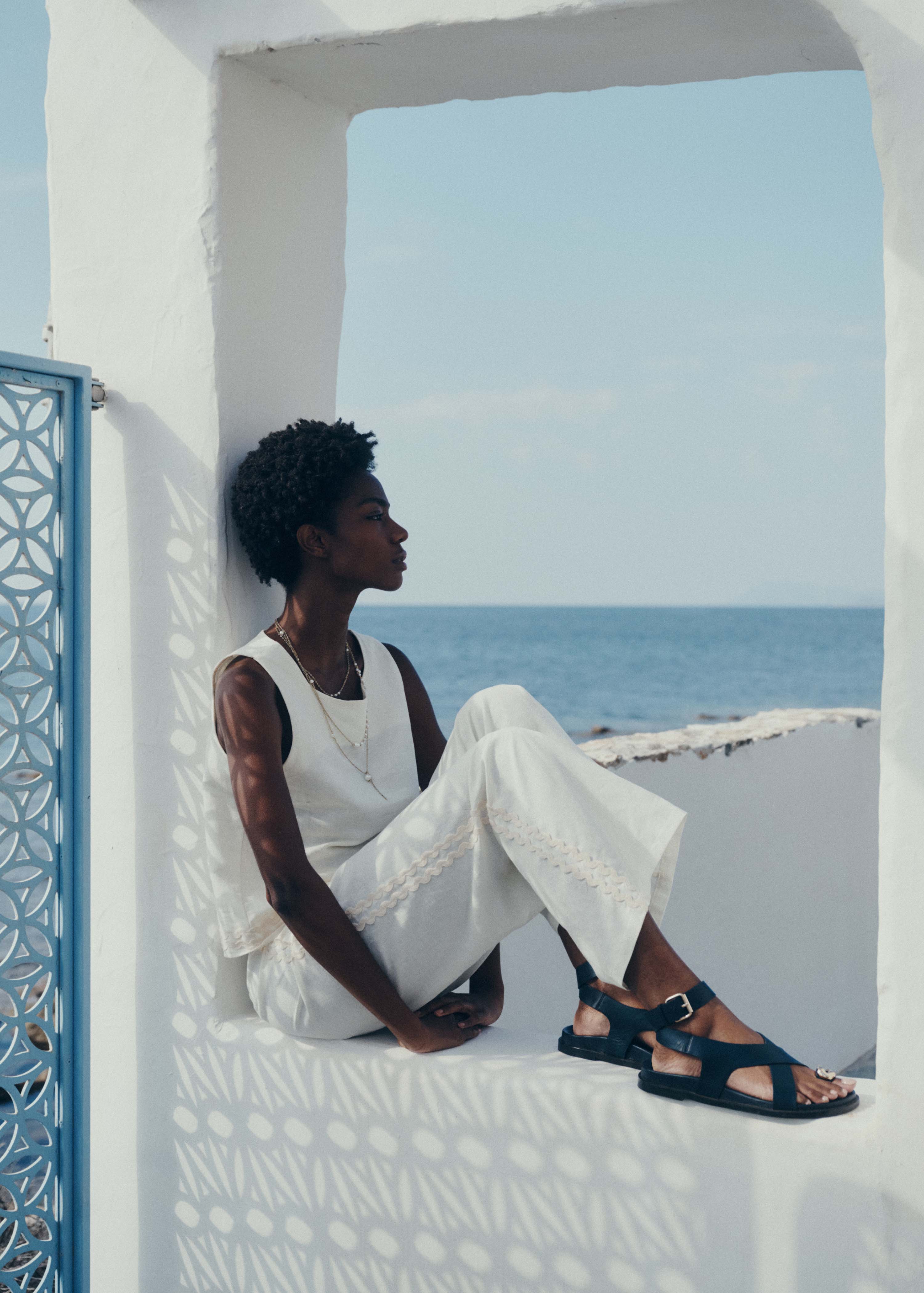 Wide high-waisted trousers in off-white linen and cotton