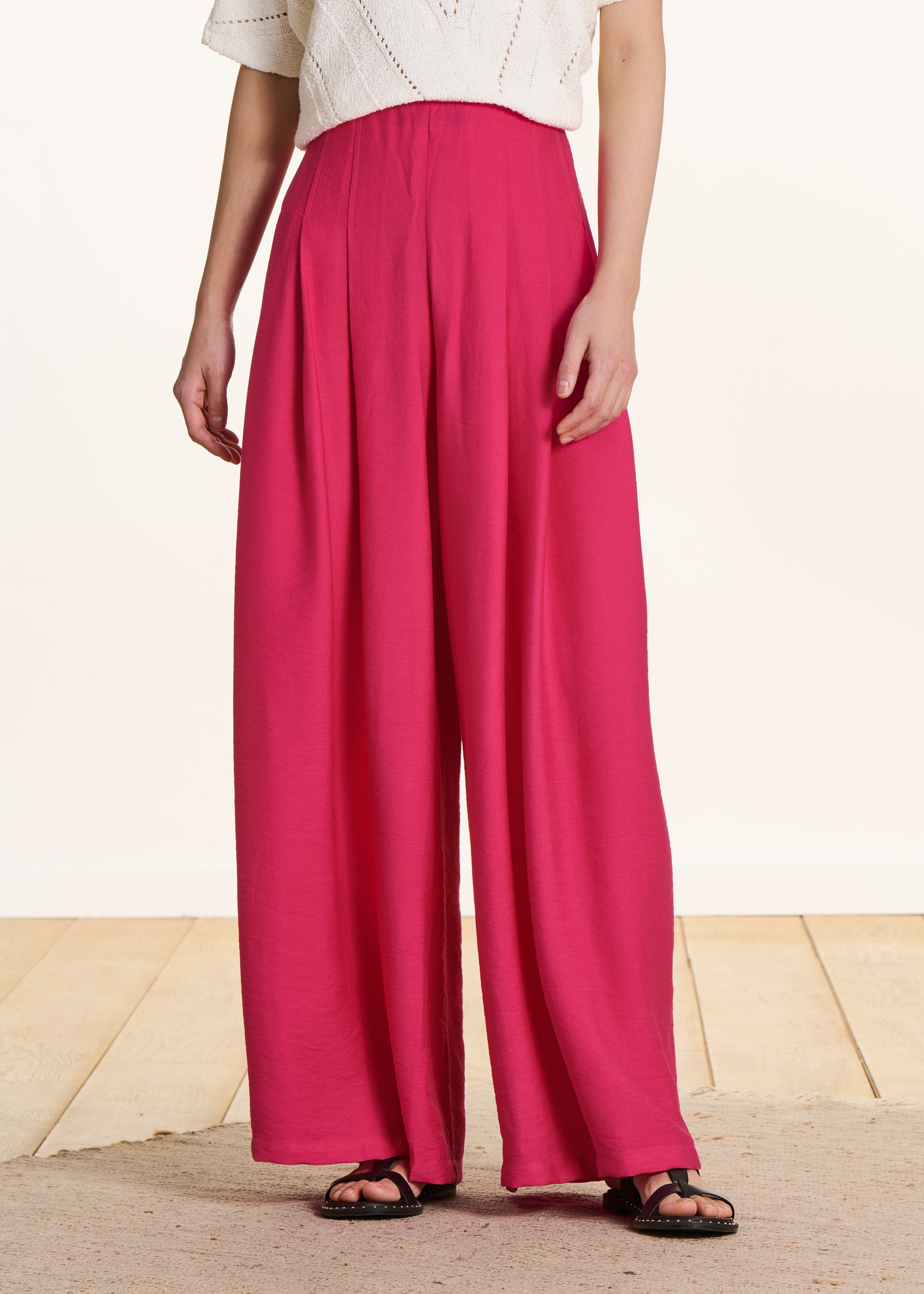 Wide high-waisted pink fuchsia pants with elastic waistband