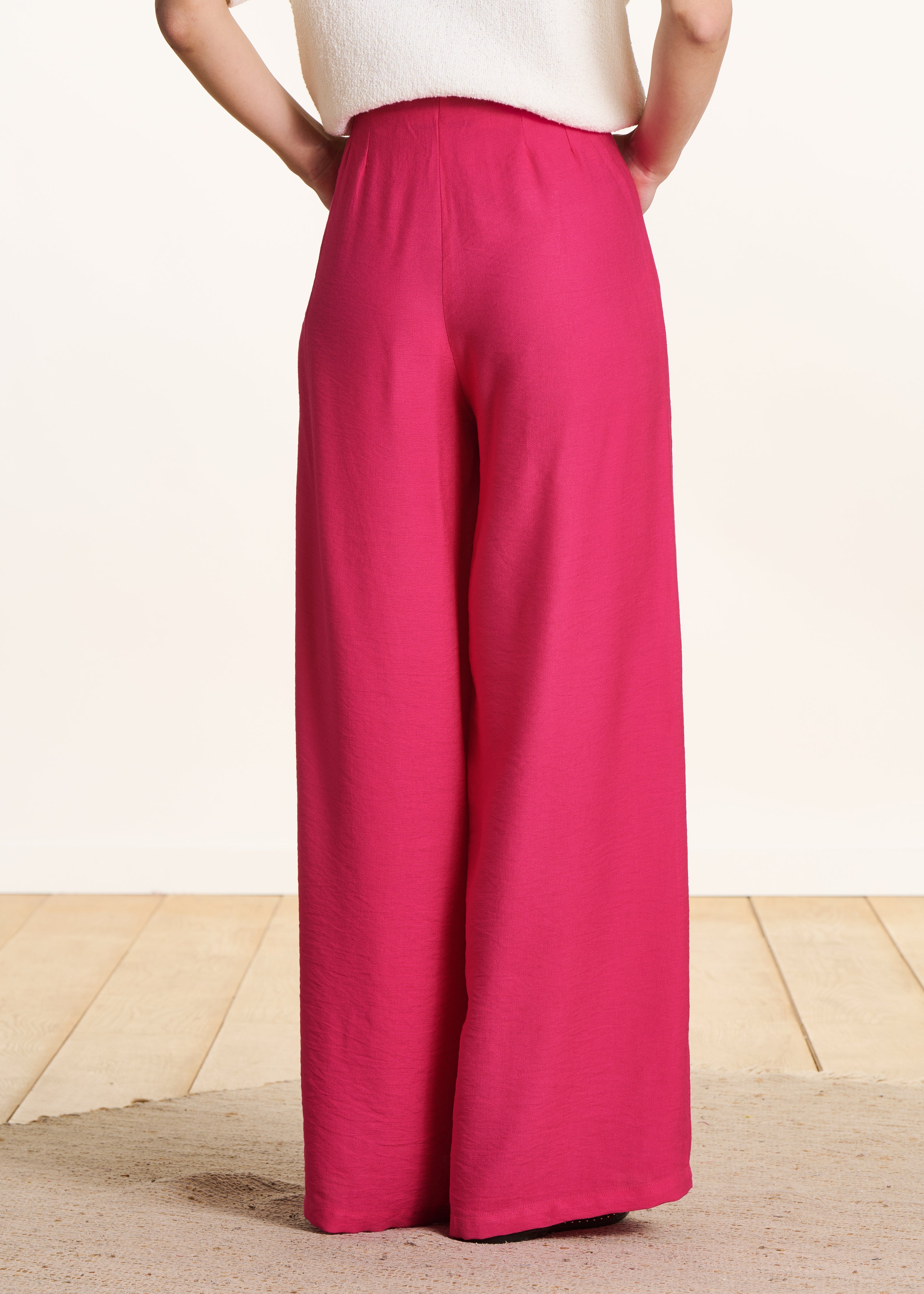 Wide high-waisted pink fuchsia pants with elastic waistband