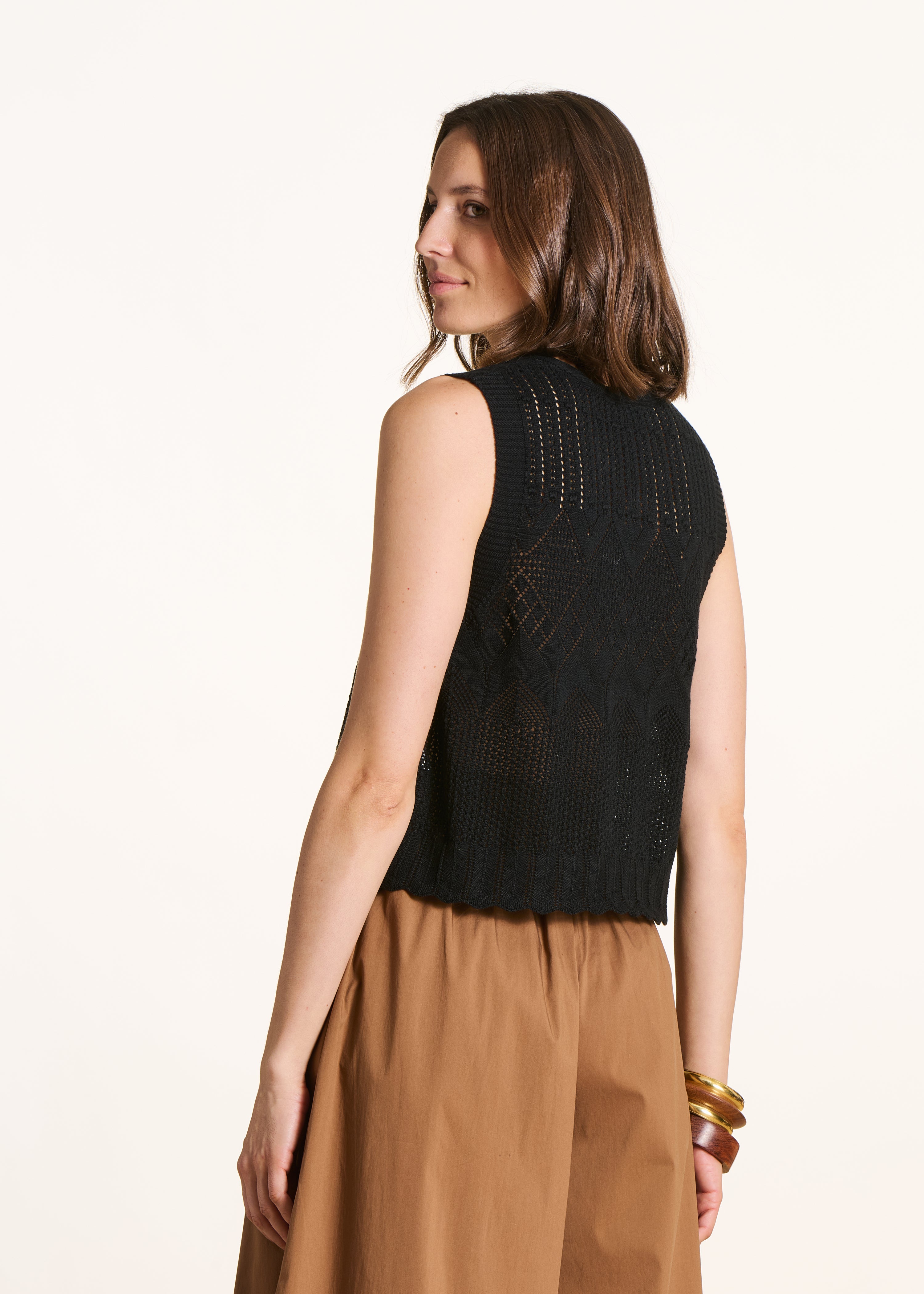 Black sleeveless cropped sweater in pointelle knit