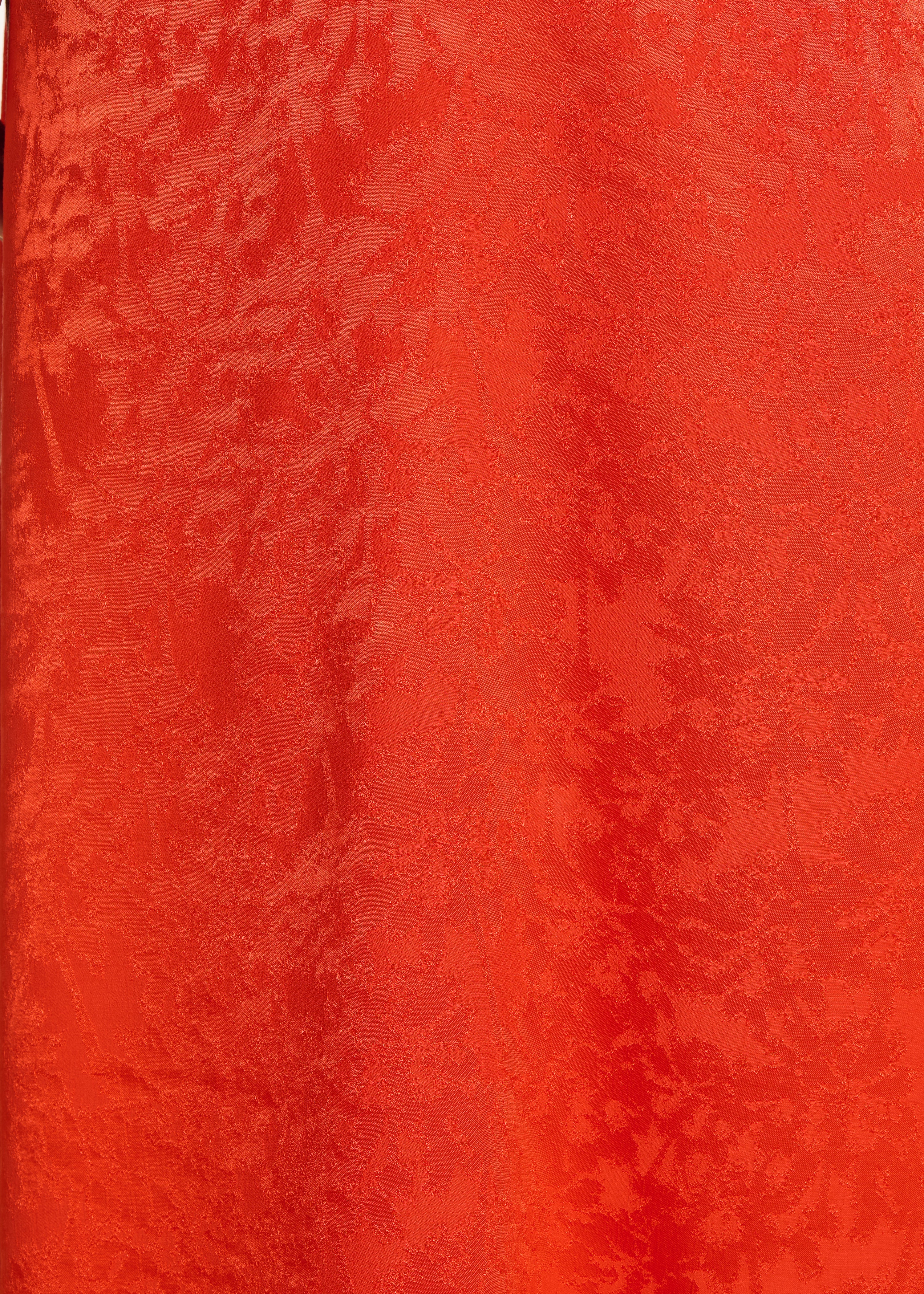 Abito lungo fluido arancione in jacquard