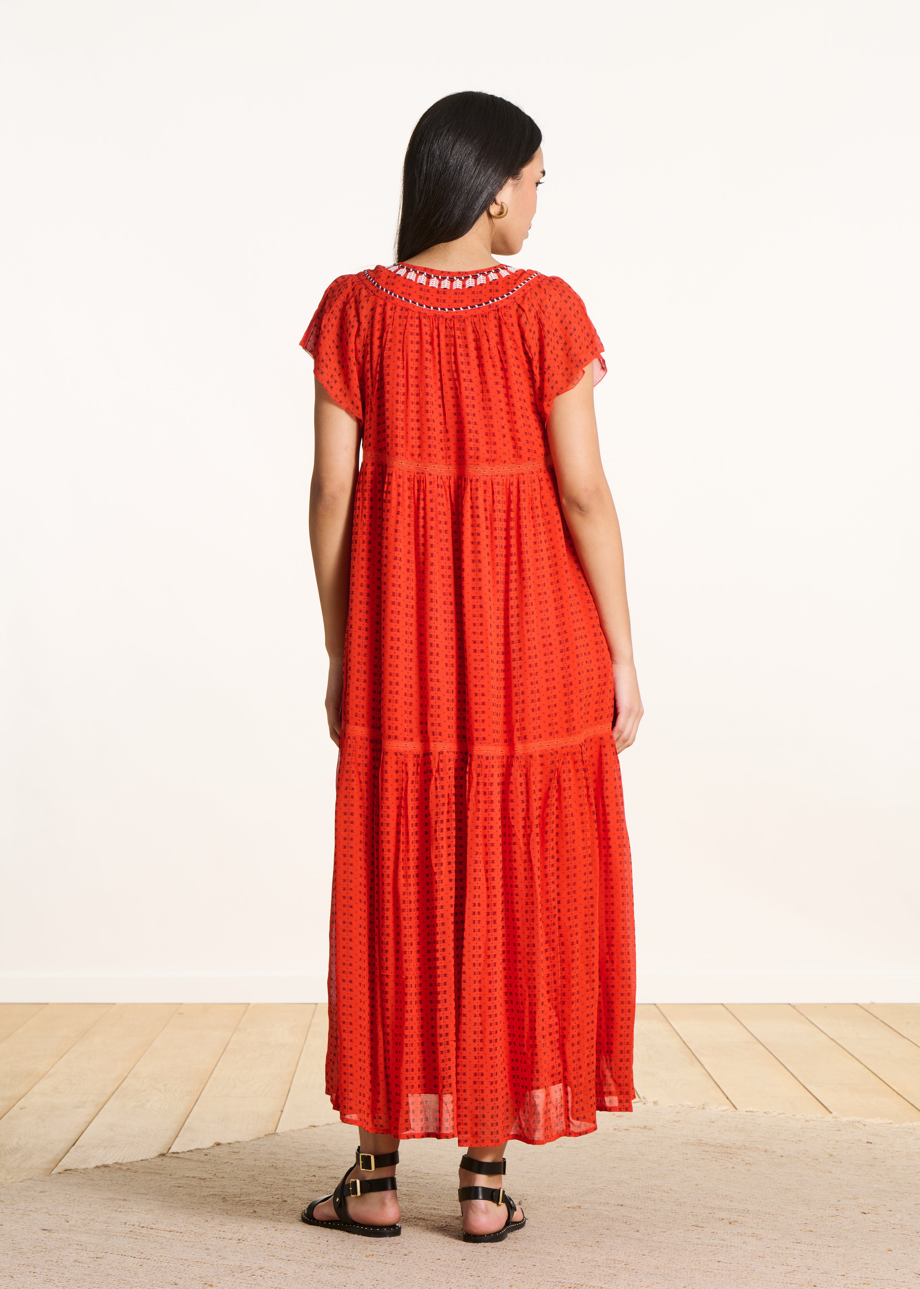Long orange printed dress with ruffles