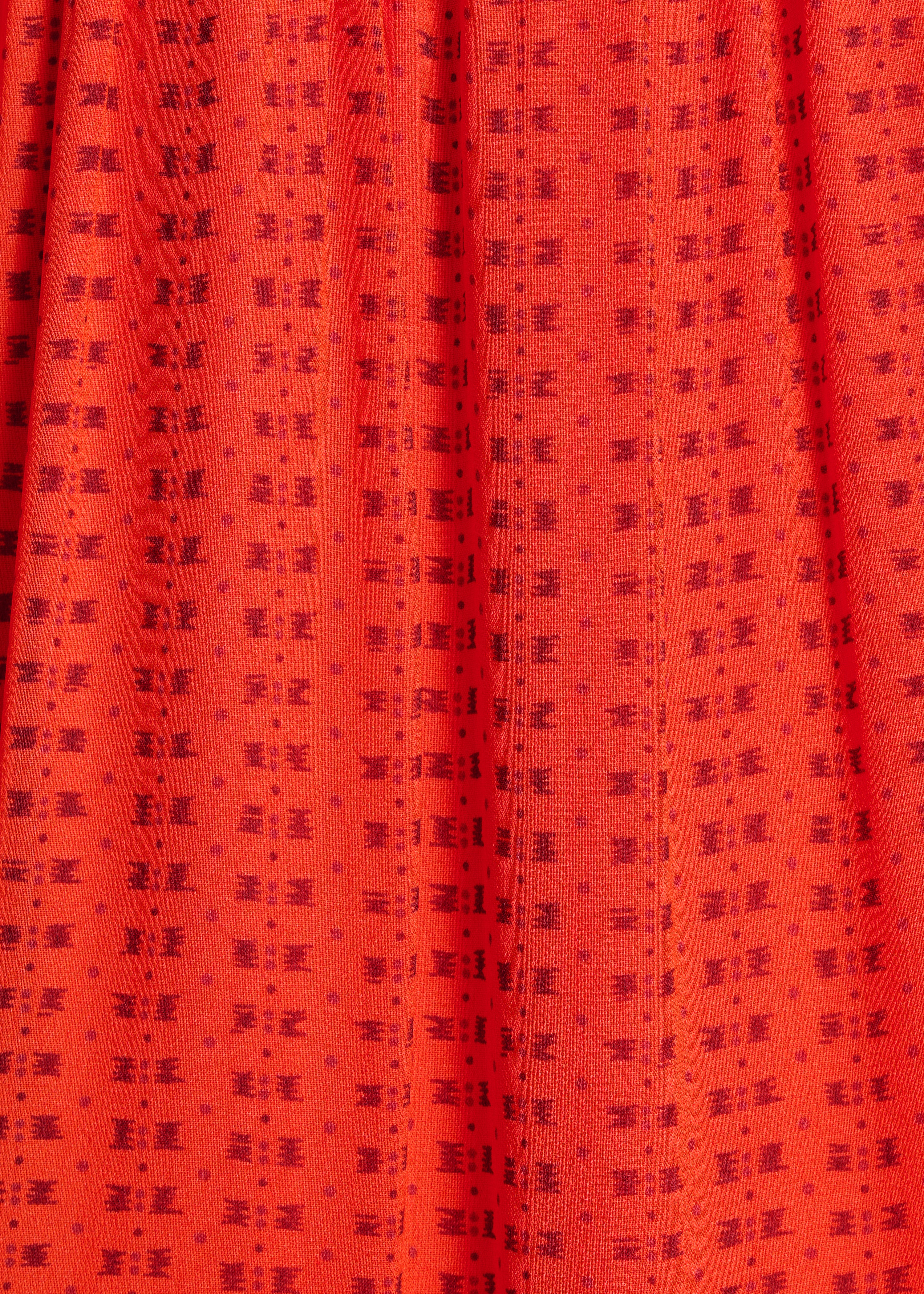 Long orange printed dress with ruffles