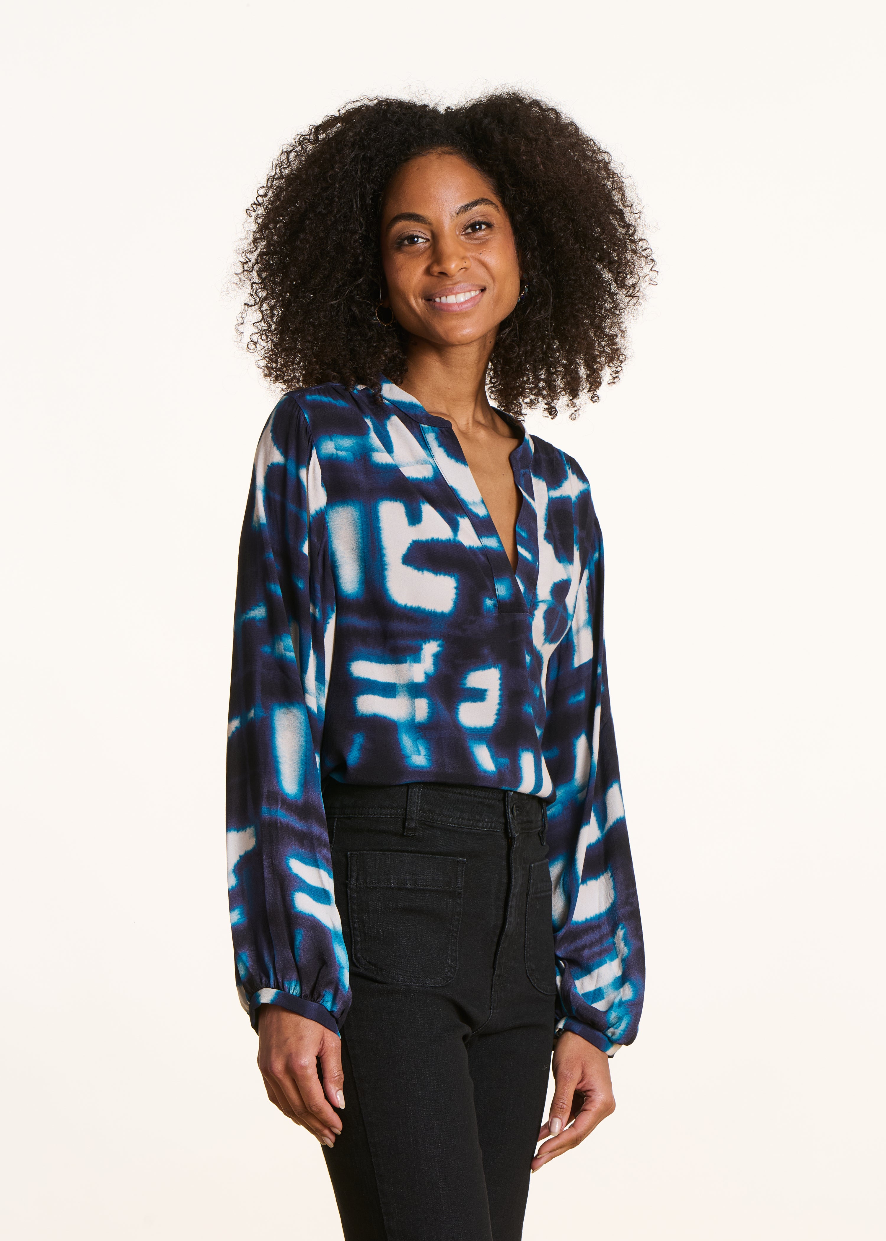 Loose blue long-sleeved top with print