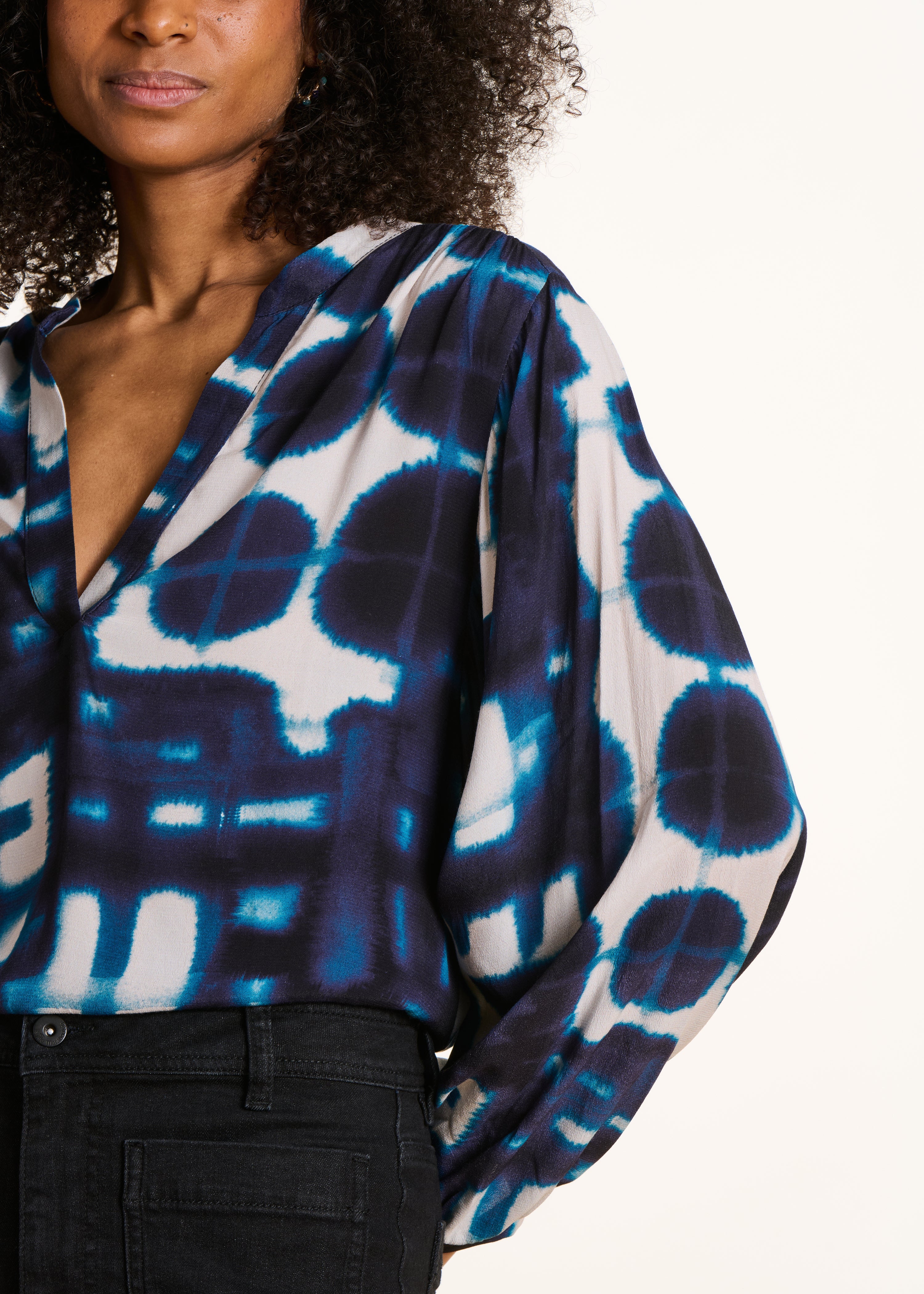 Loose blue long-sleeved top with print