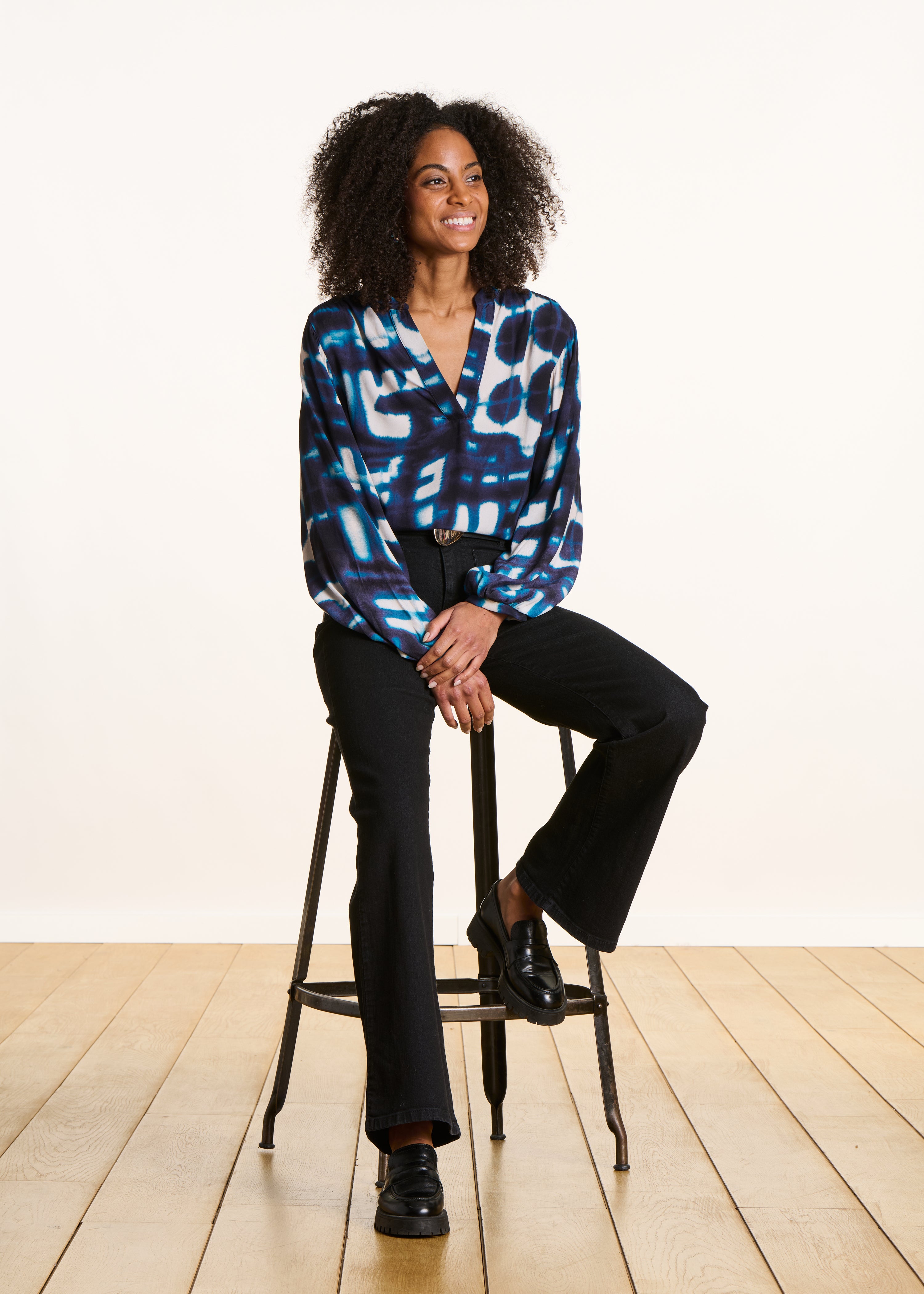 Loose blue long-sleeved top with print