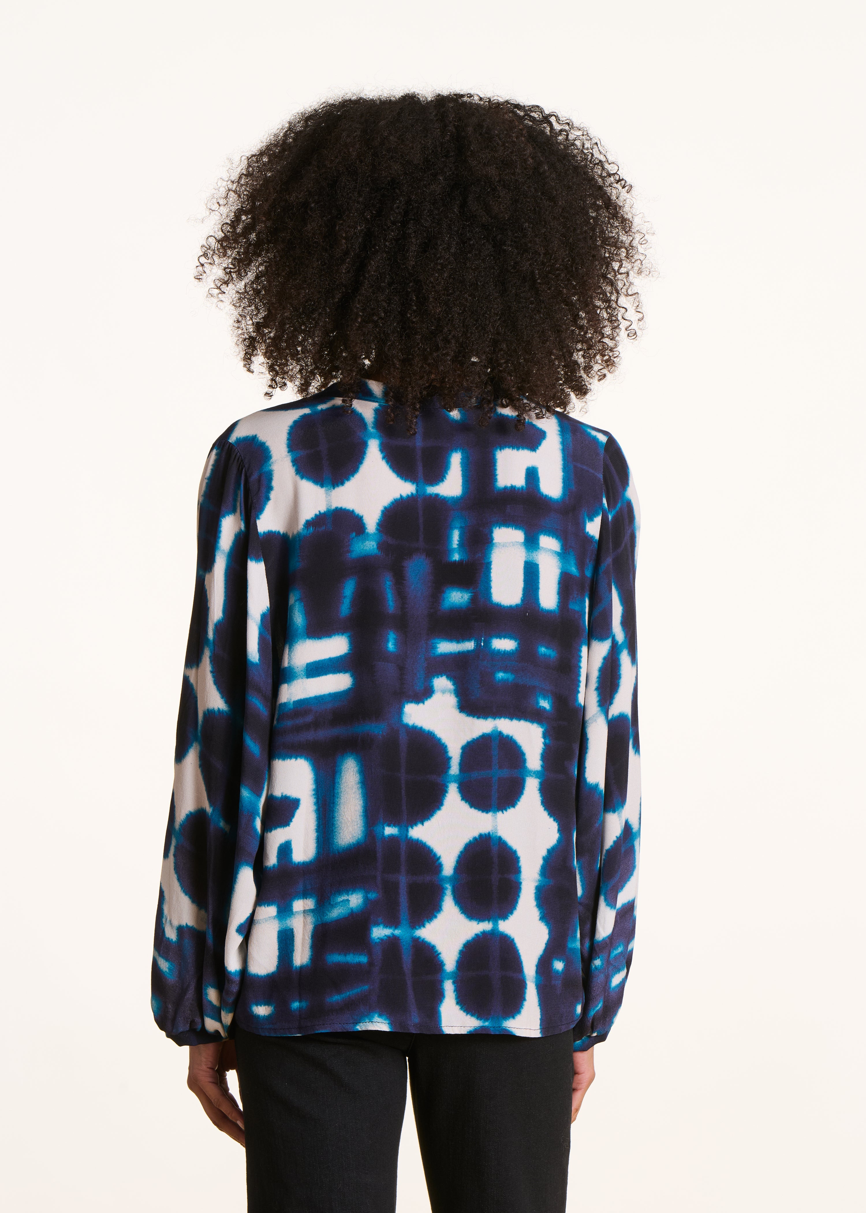 Loose blue long-sleeved top with print