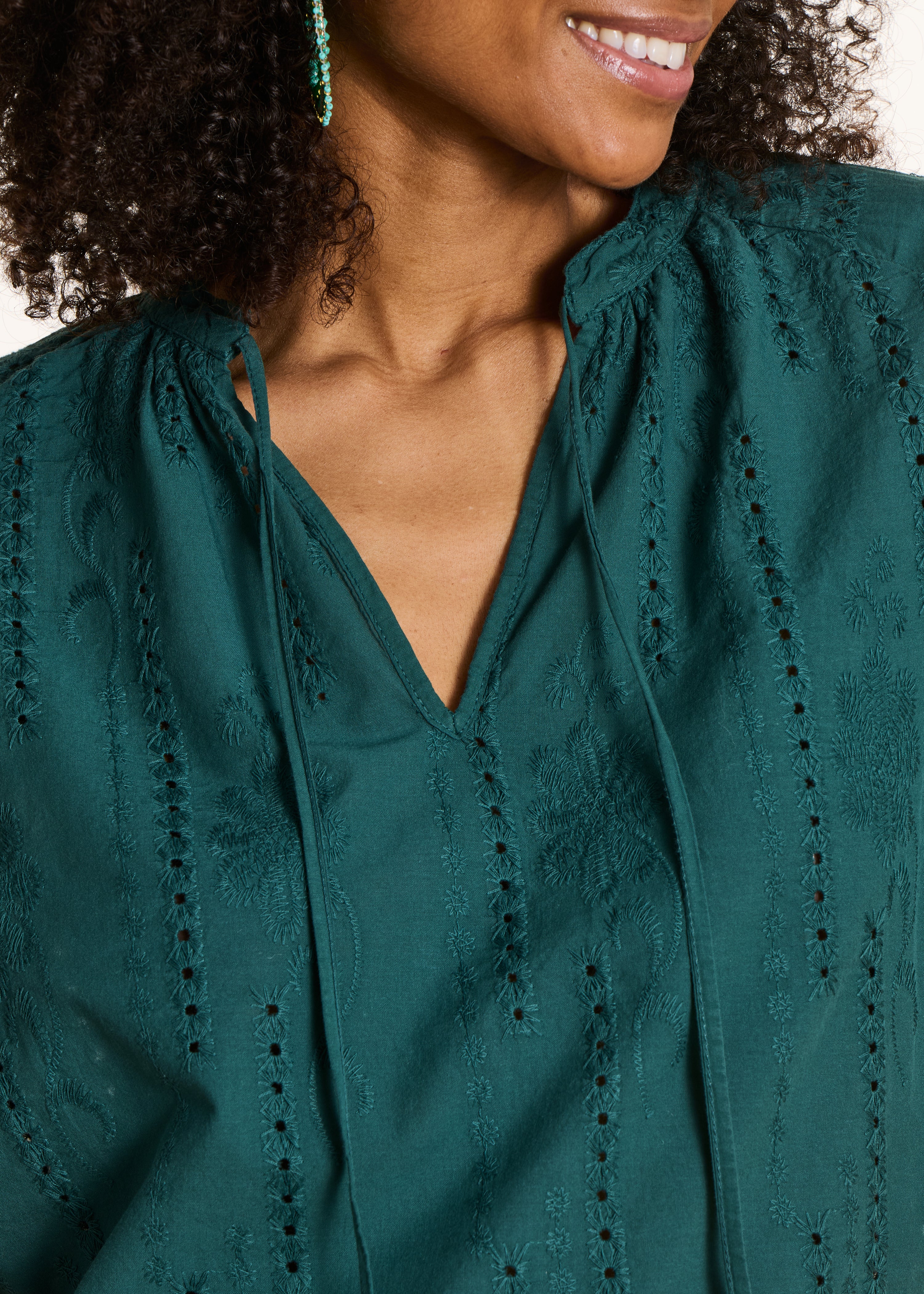 Loose blouse in dark green eyelet embroidery