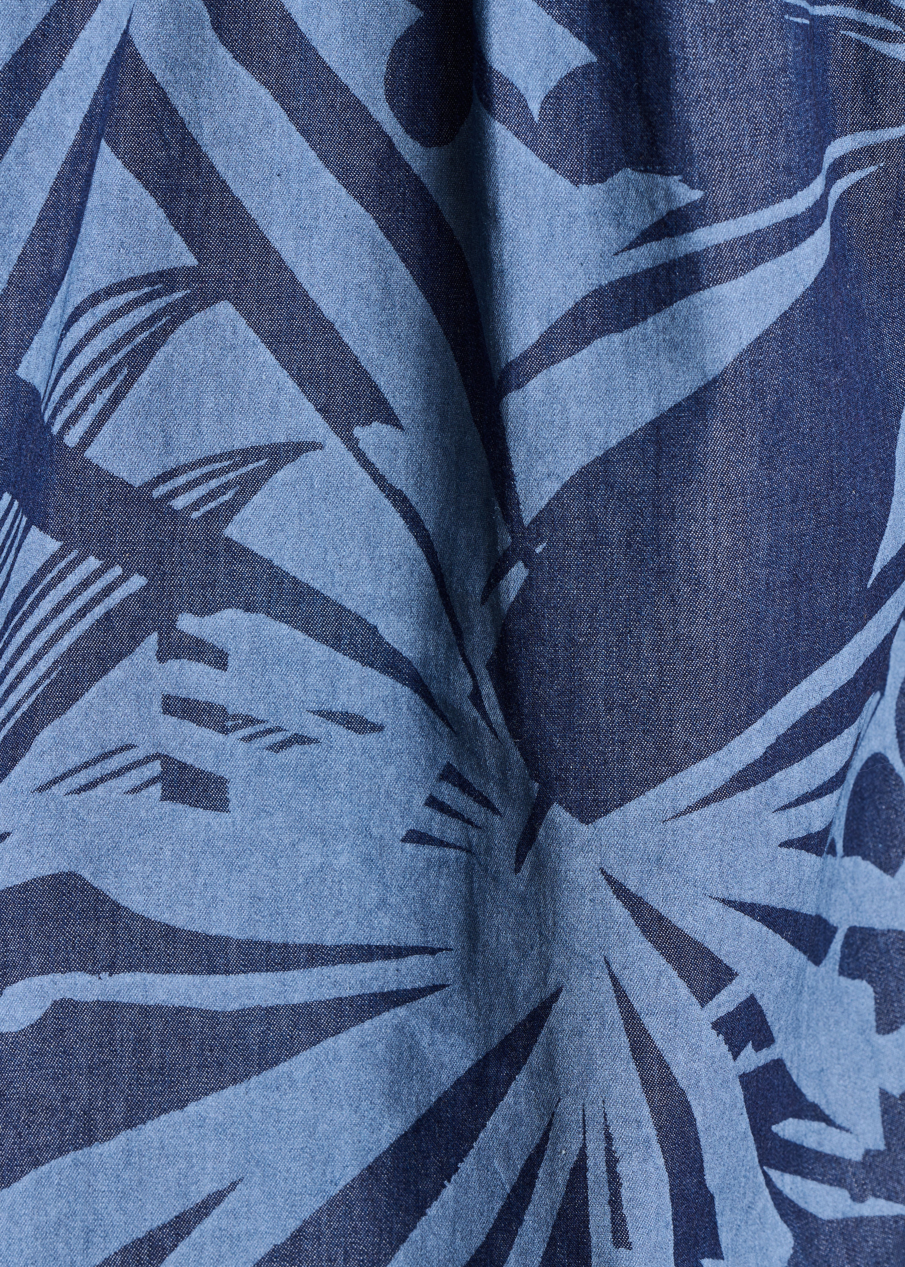 Loose blue cotton top with print