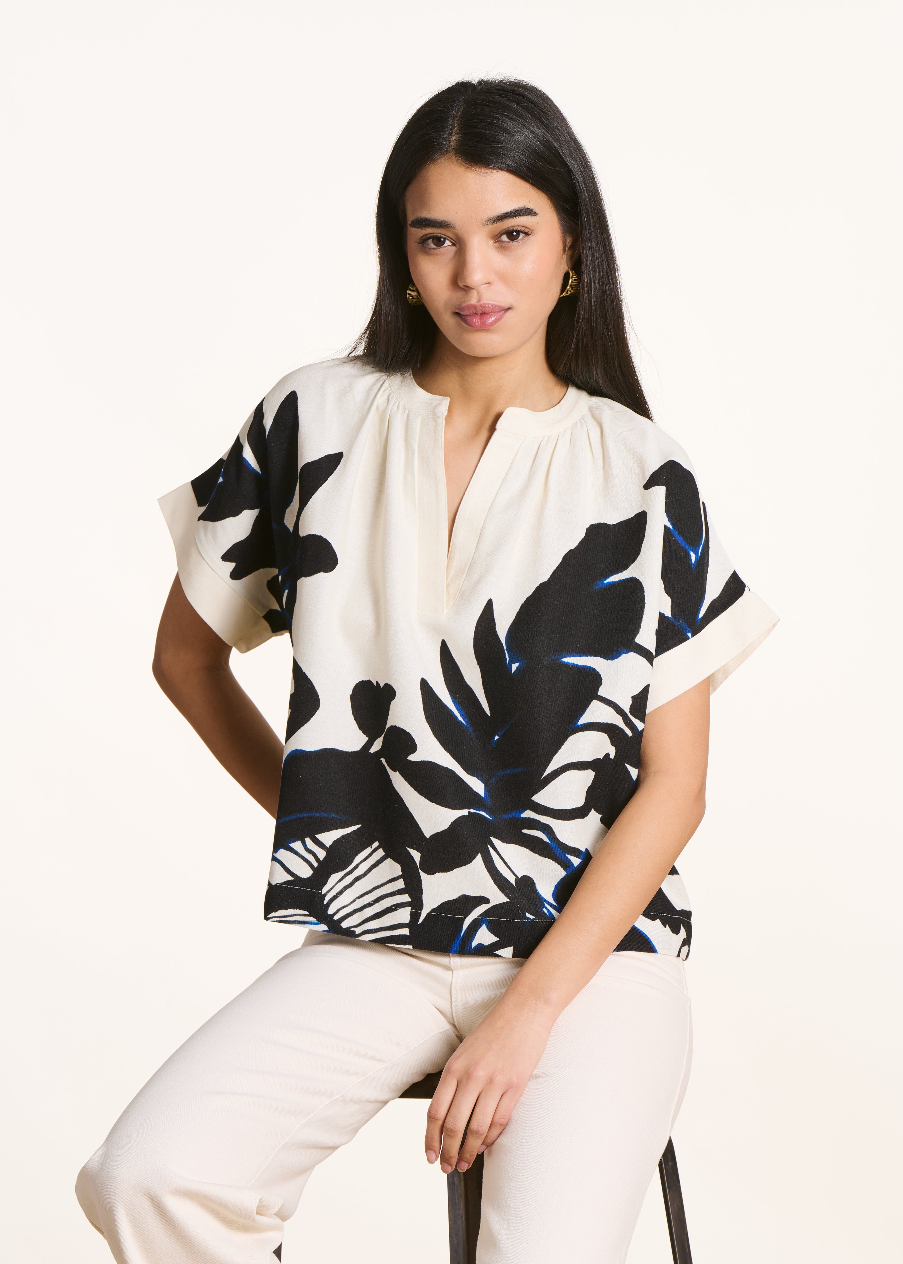 Loose ecru top with black print