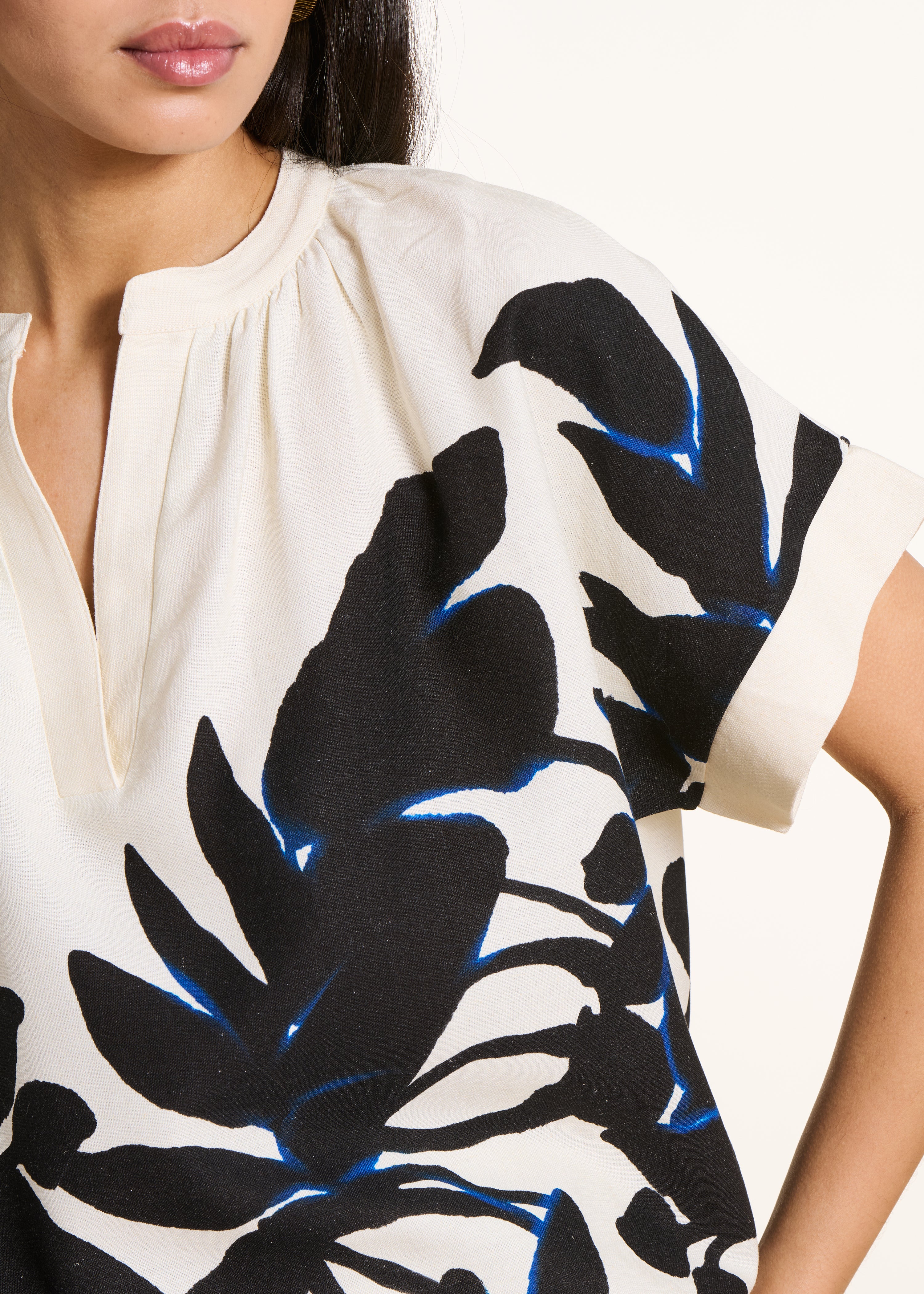 Loose ecru top with black print