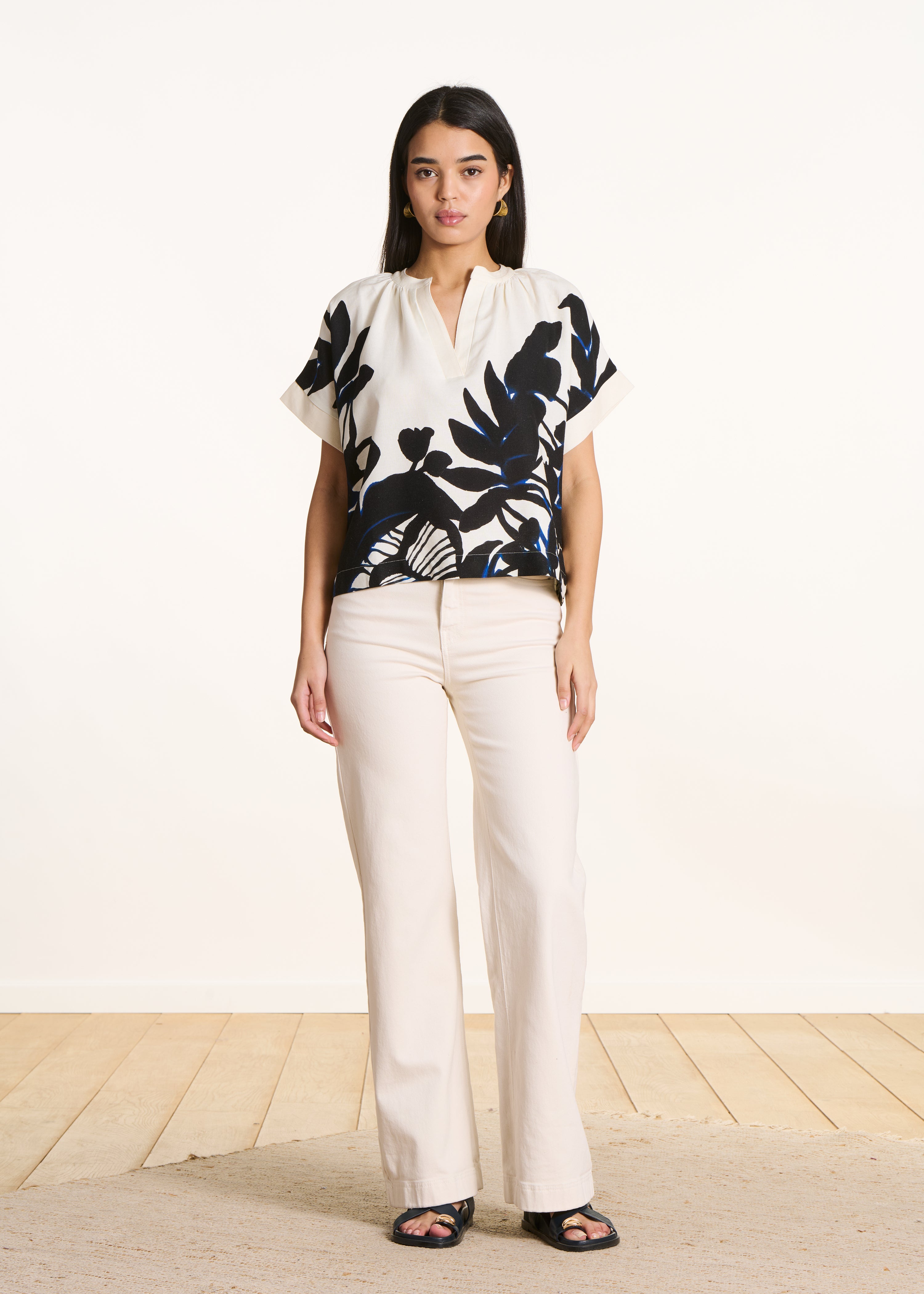 Loose ecru top with black print