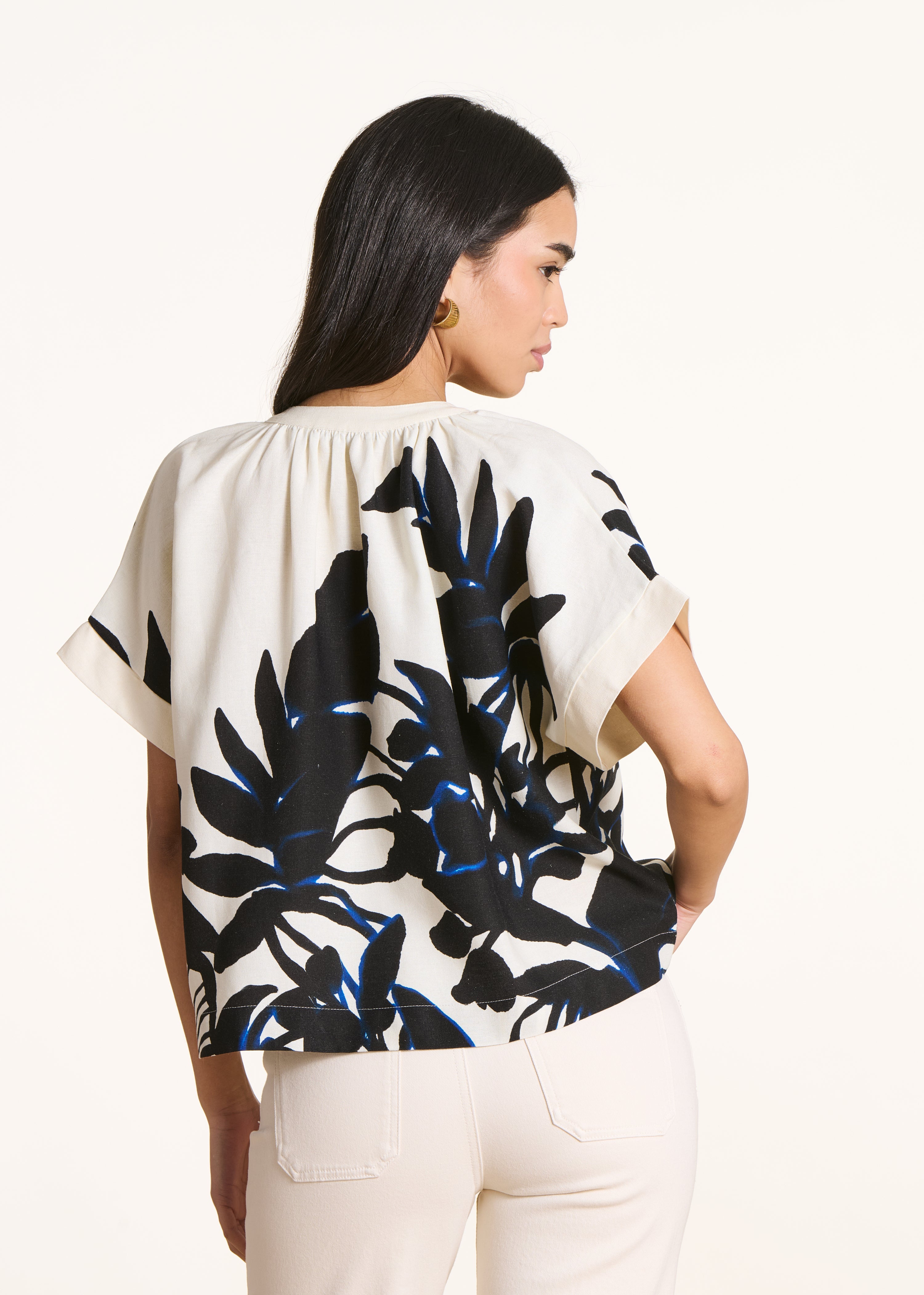 Loose ecru top with black print