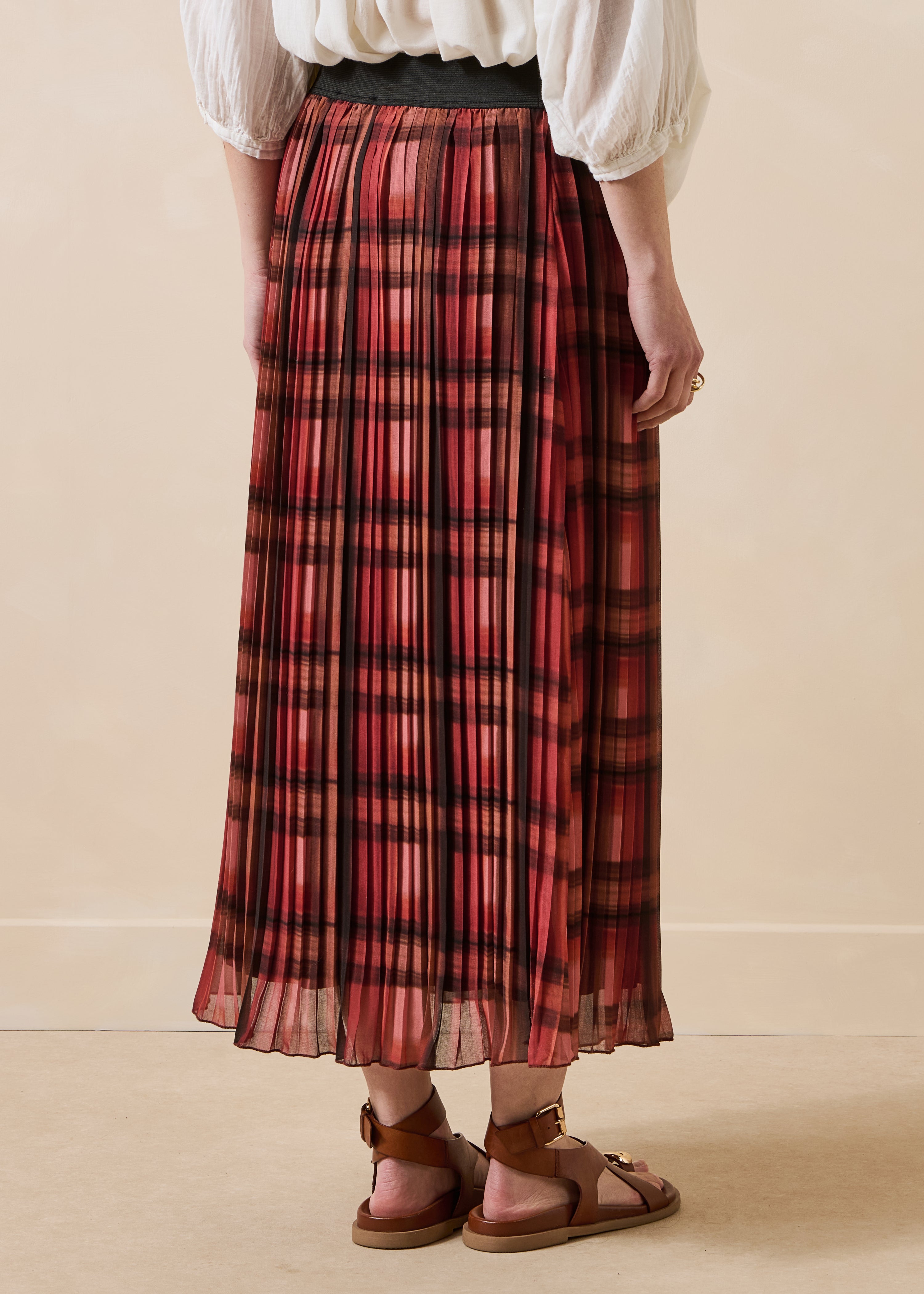 Jupe midi plissée terracotta à carreaux