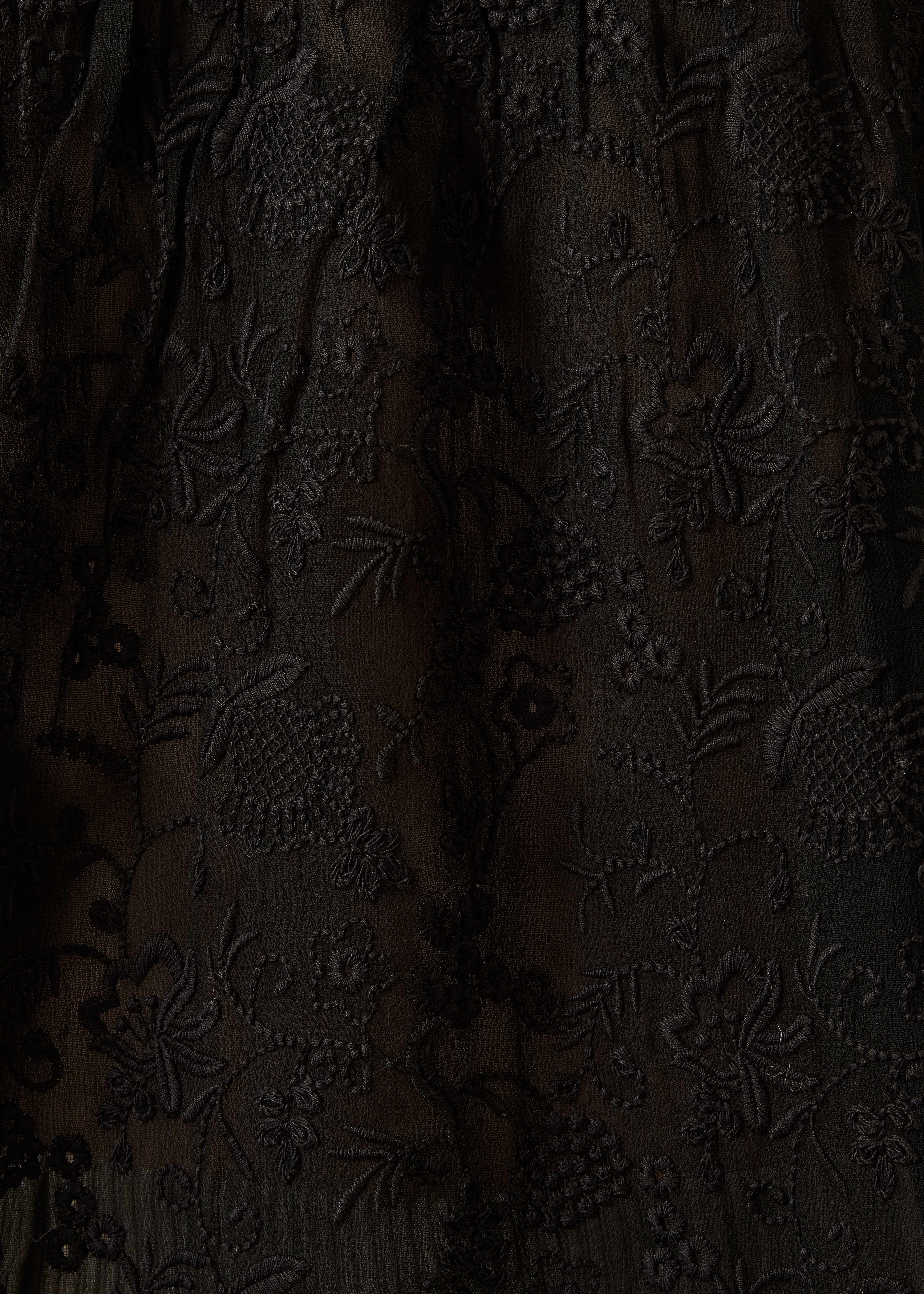 Schwarze bestickte Bluse mit langen Ärmeln
