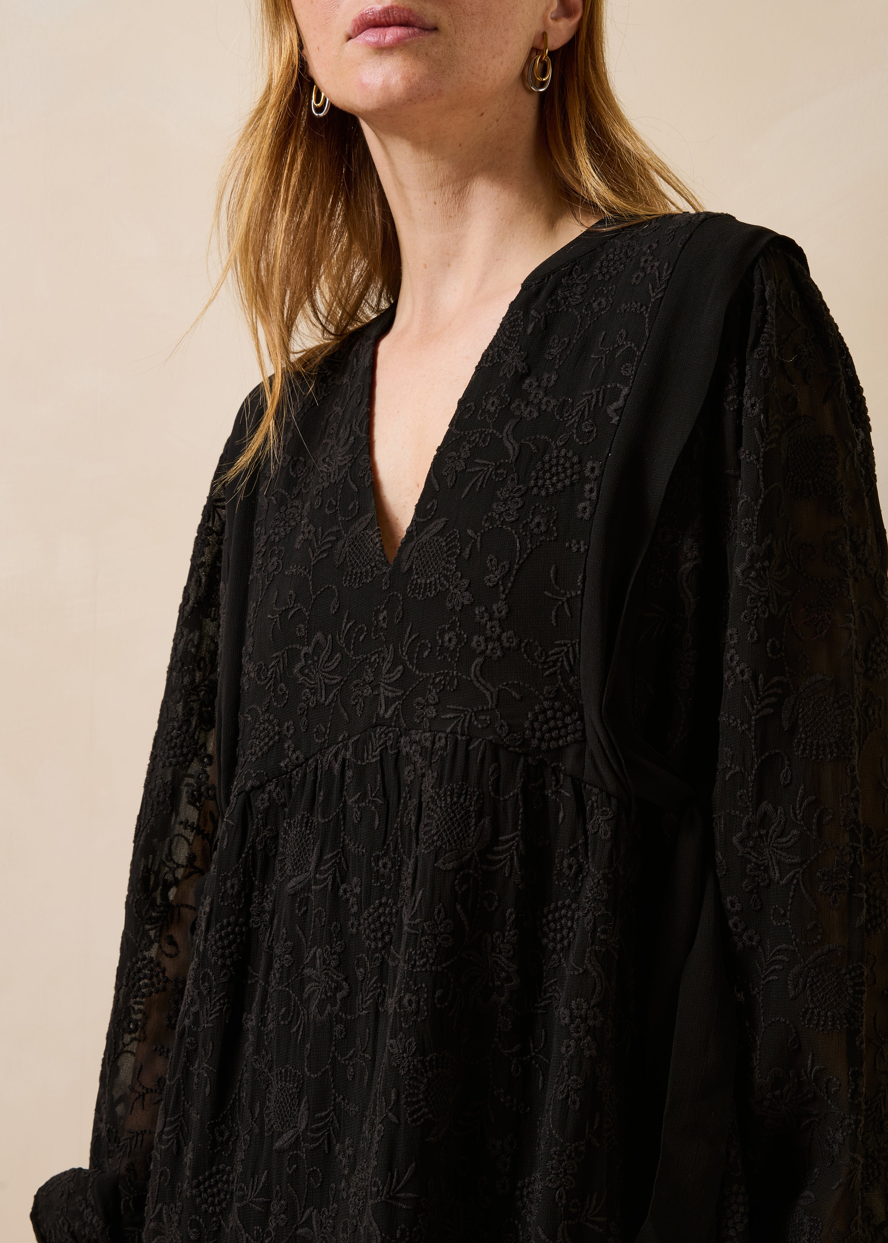 Black embroidered short dress with long sleeves