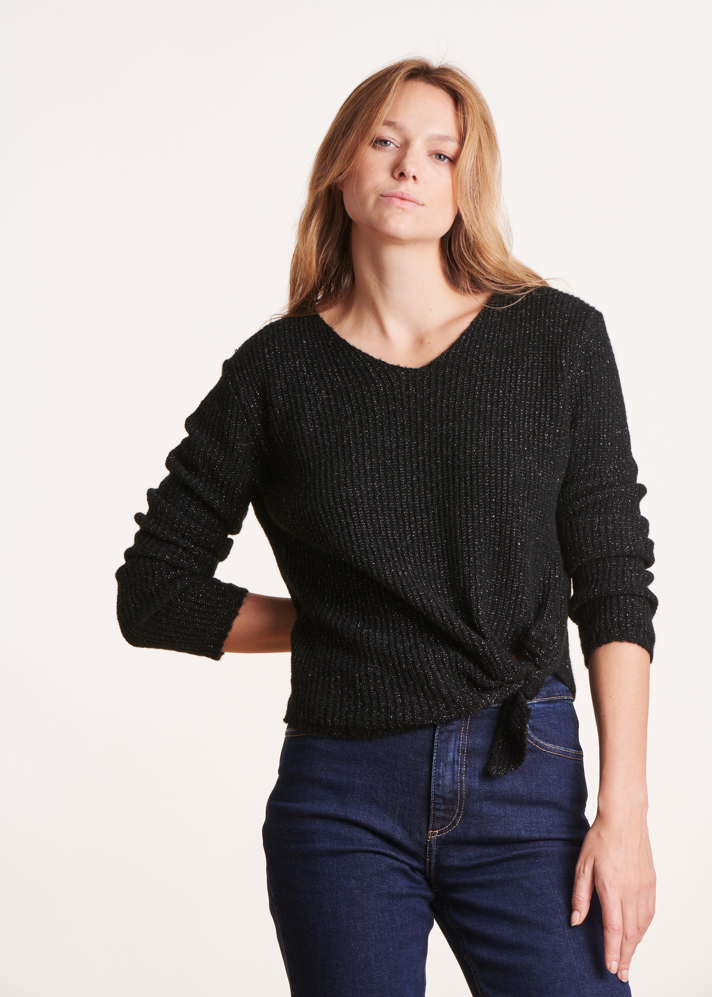 Short black iridescent knit sweater with bow