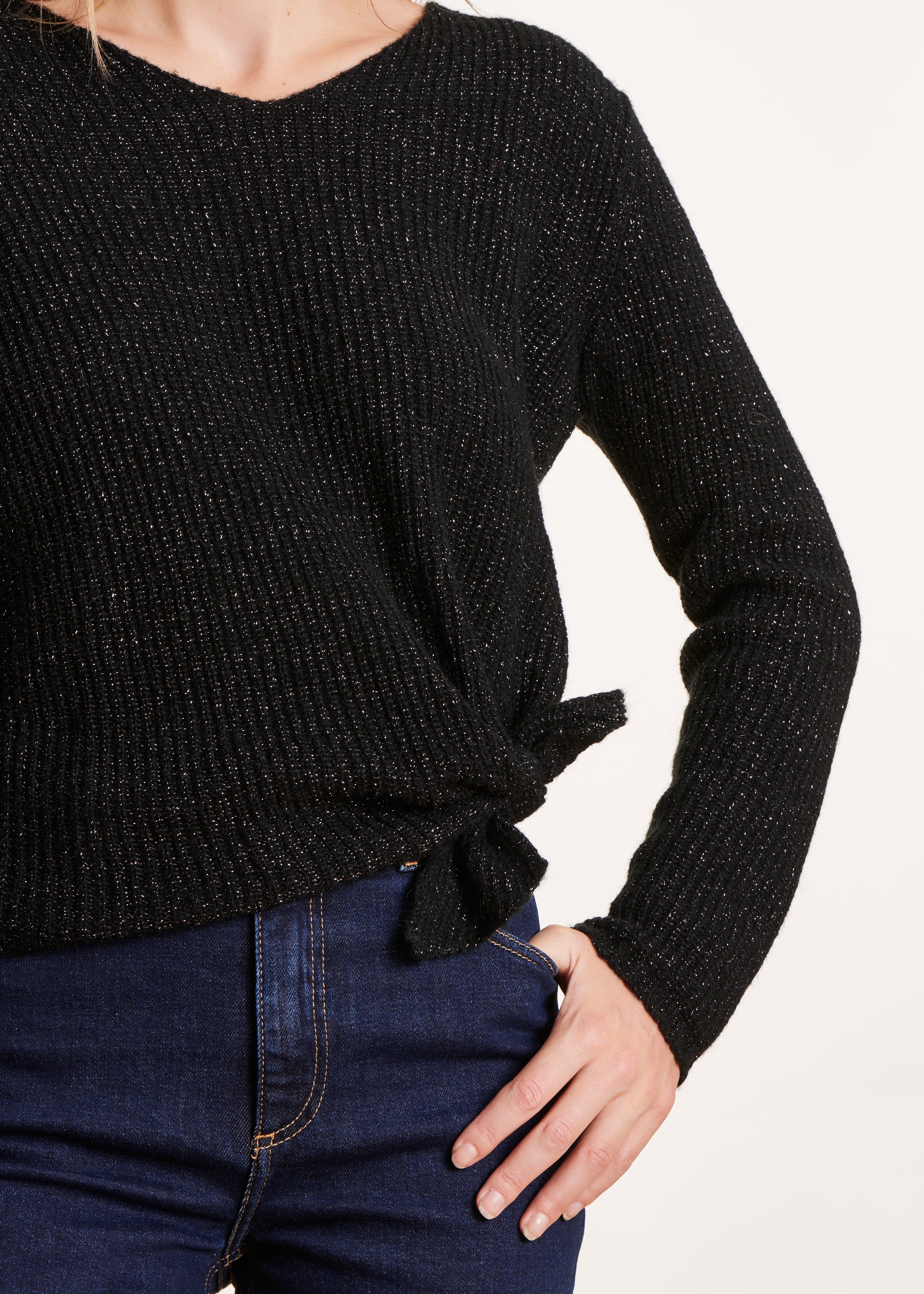 Short black iridescent knit sweater with bow