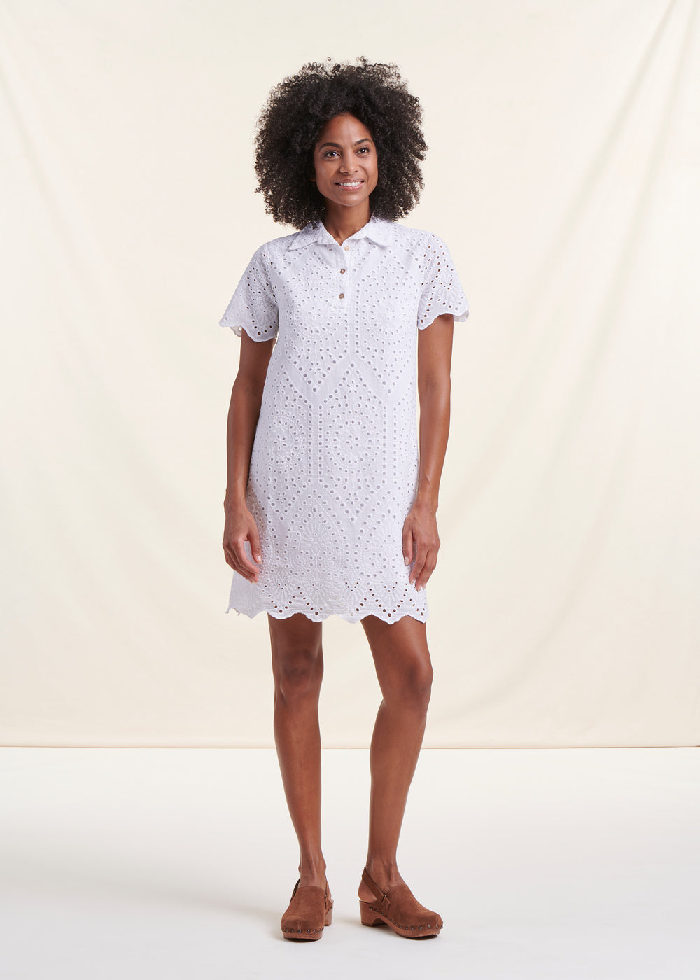 Short white dress in English embroidery