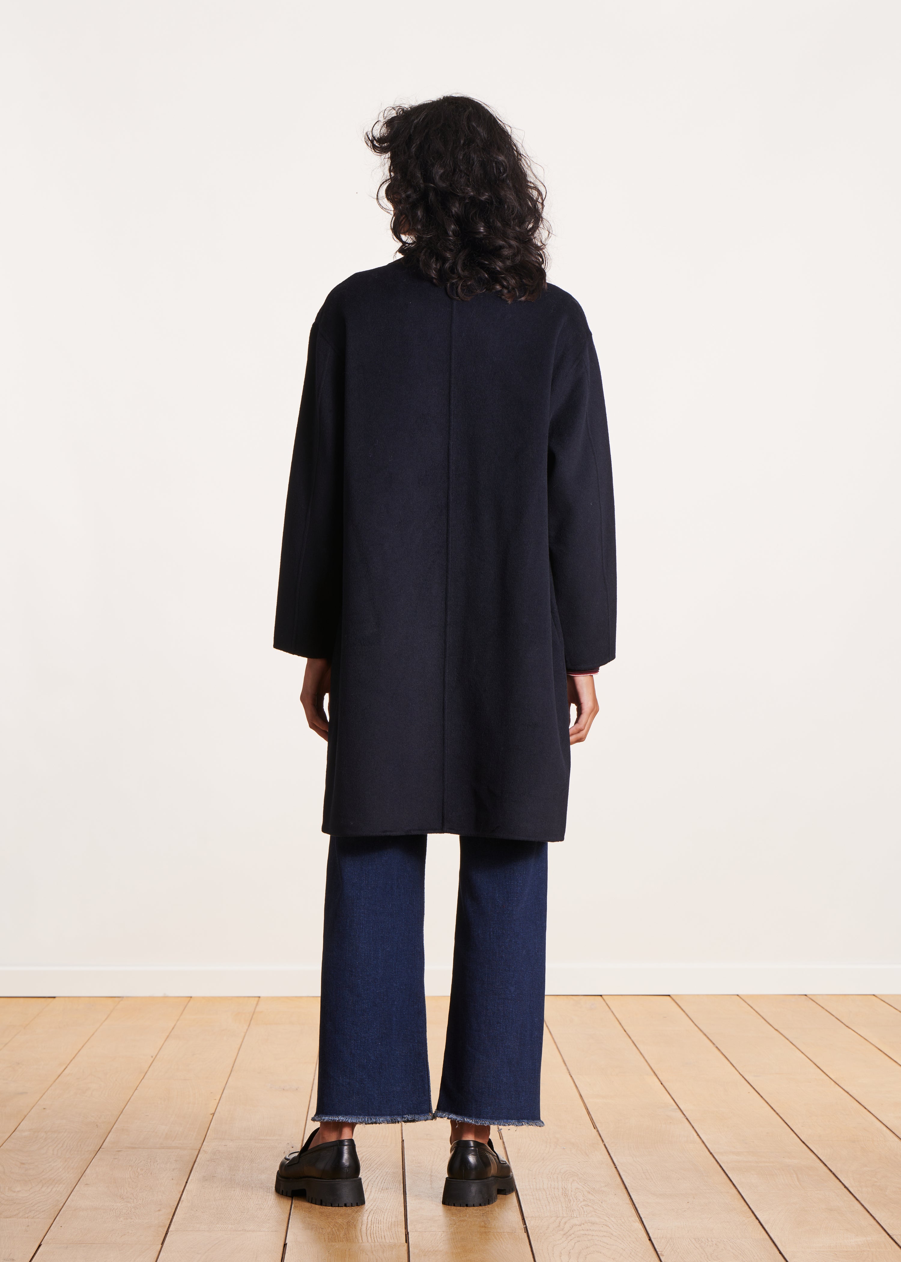 Navy blue mid-length wool coat