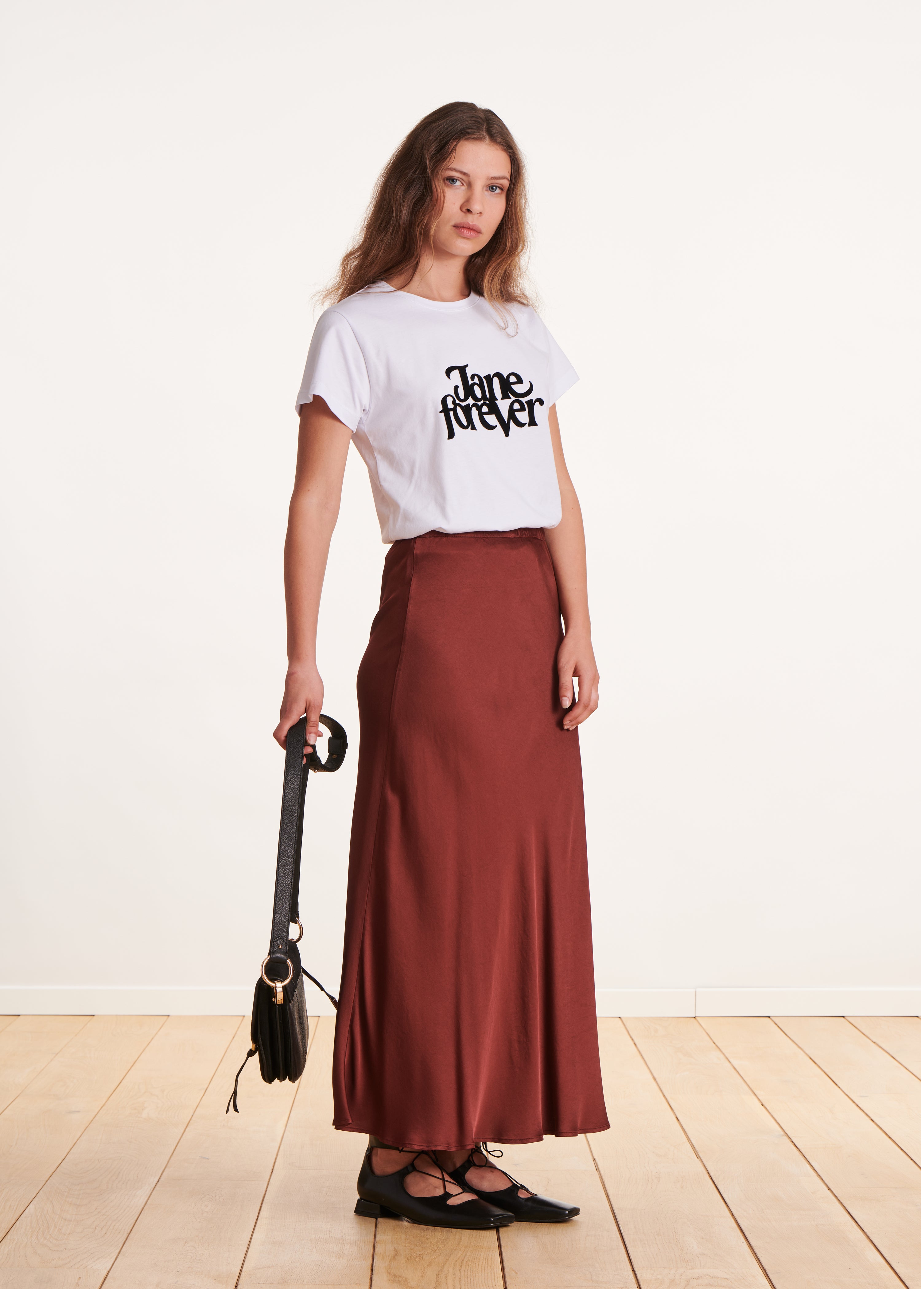 Long flowing burgundy satin skirt