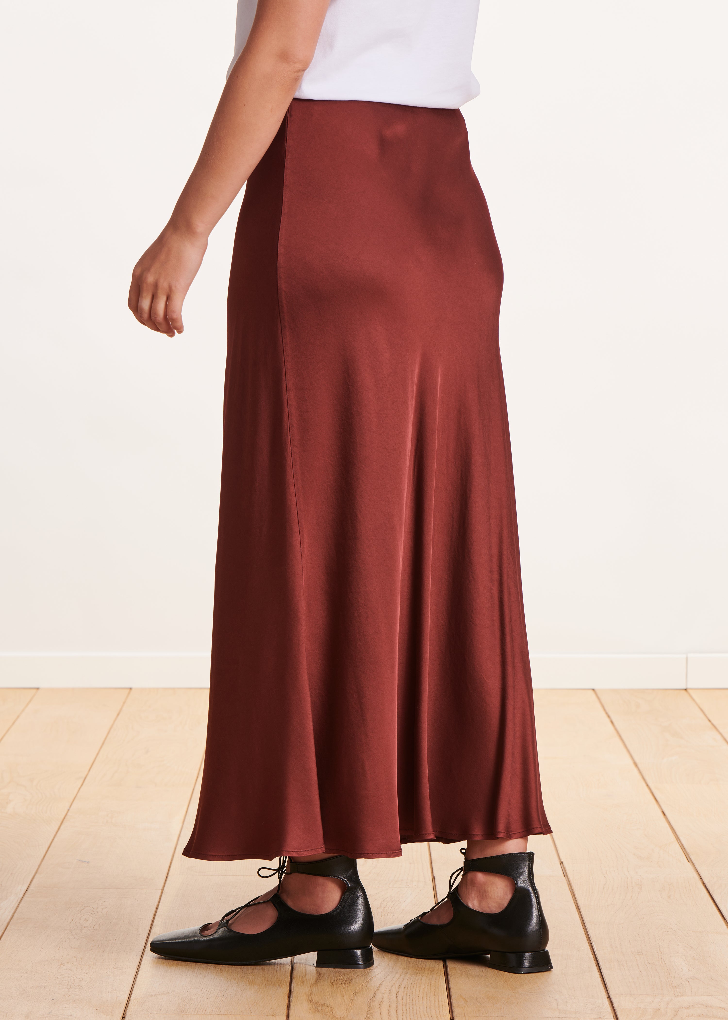 Long flowing burgundy satin skirt