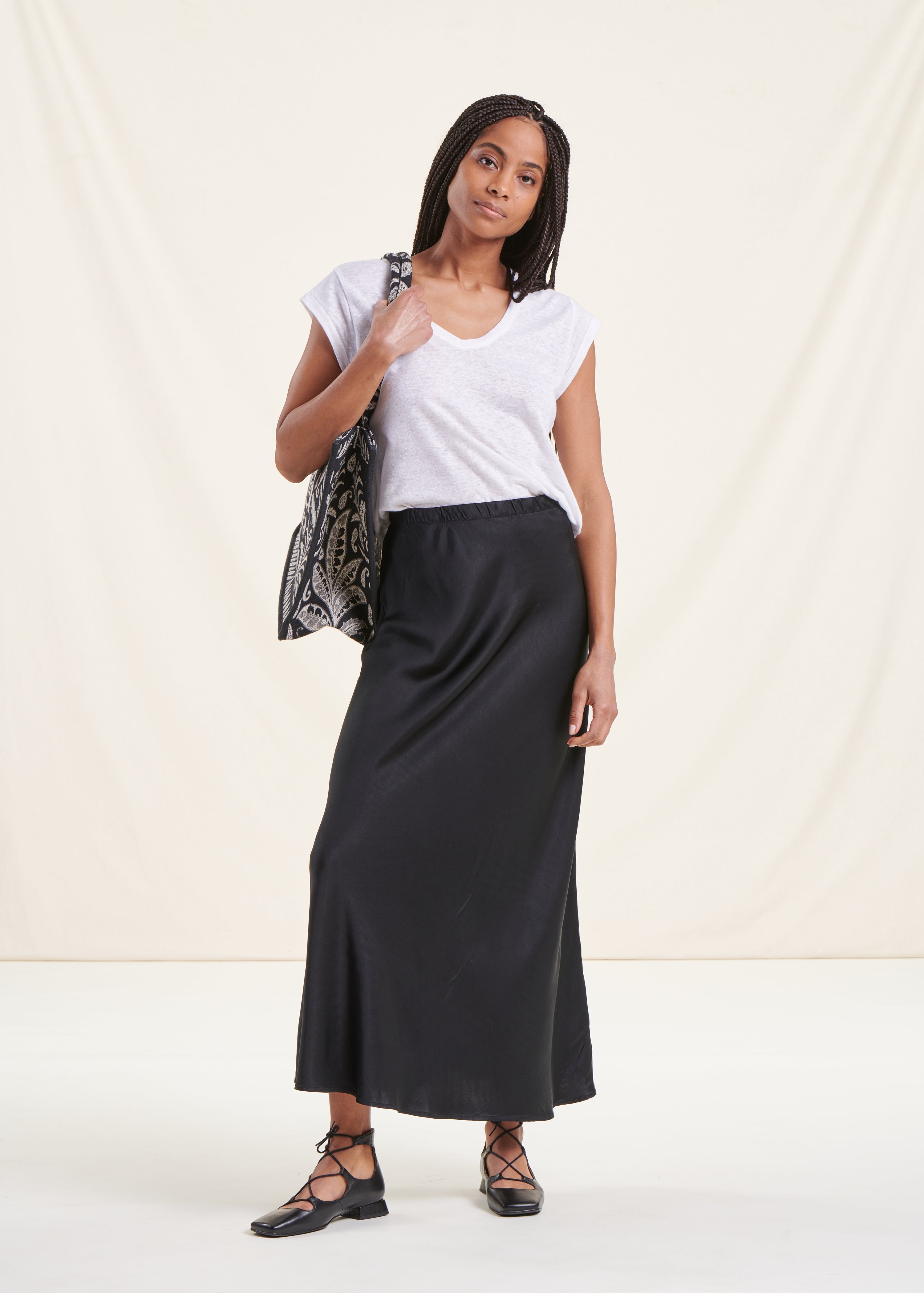 Long flowing black satin skirt