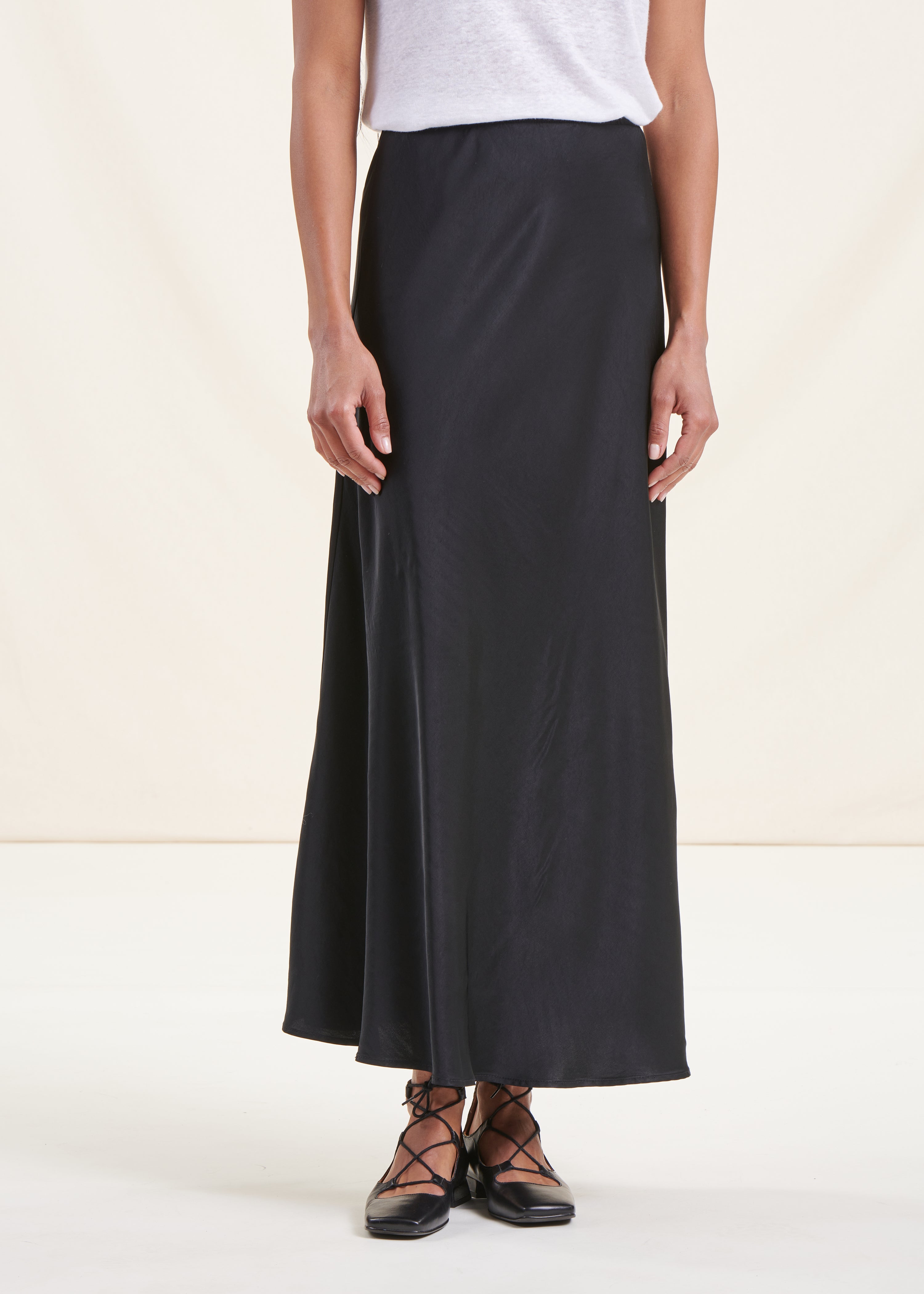 Long flowing black satin skirt