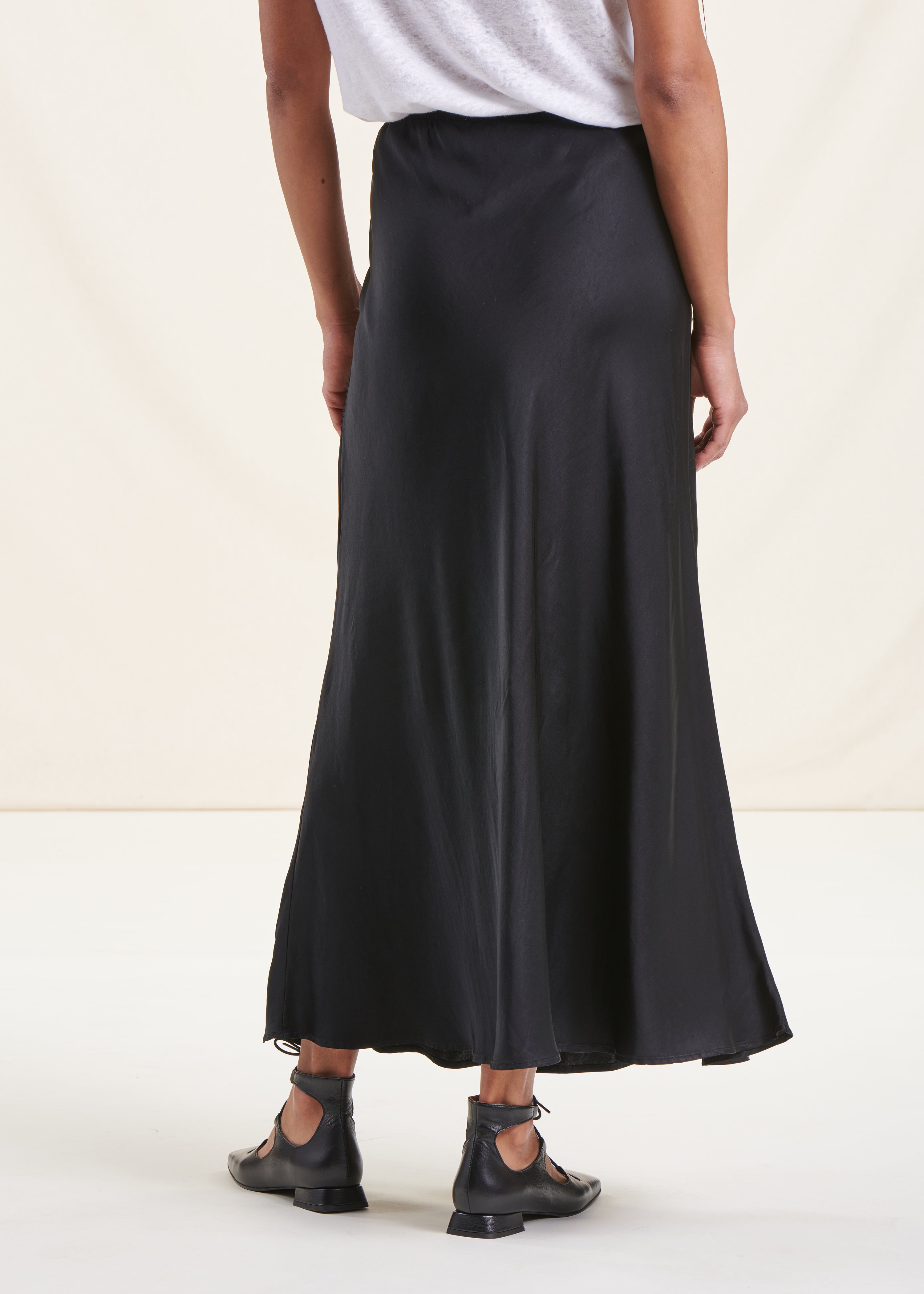 Long flowing black satin skirt