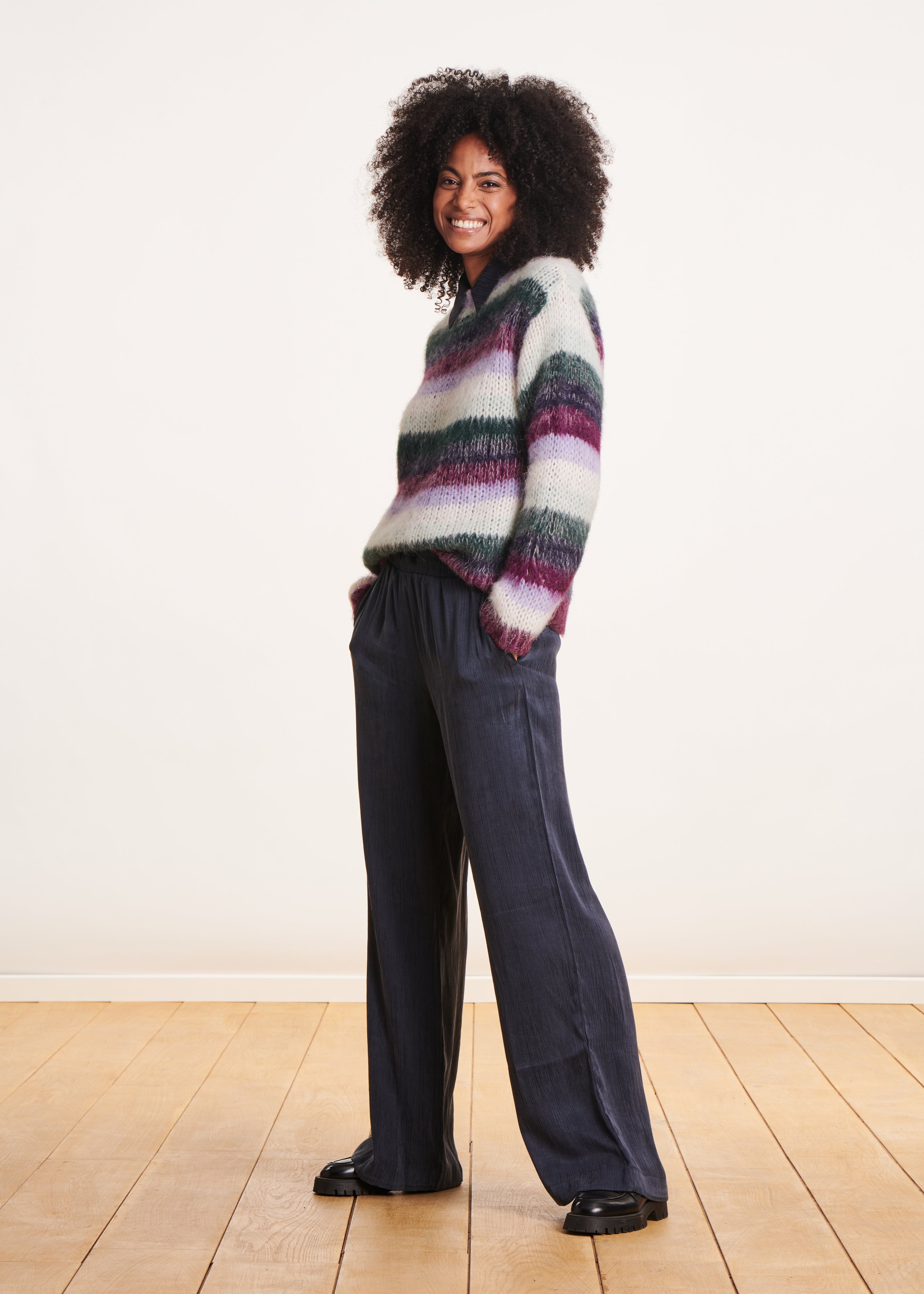 Loose purple and white sweater with wide stripes