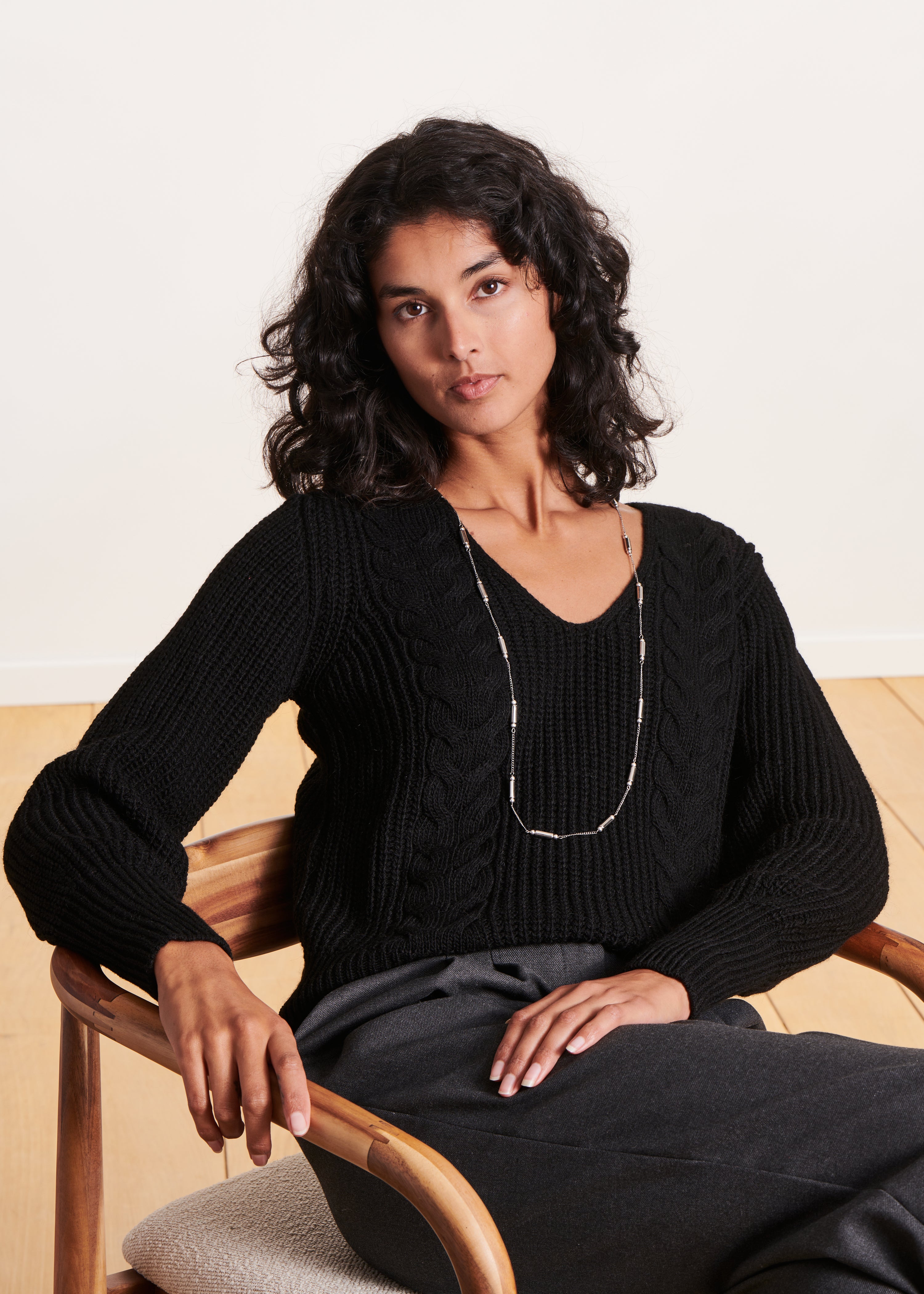 Short black V-neck sweater