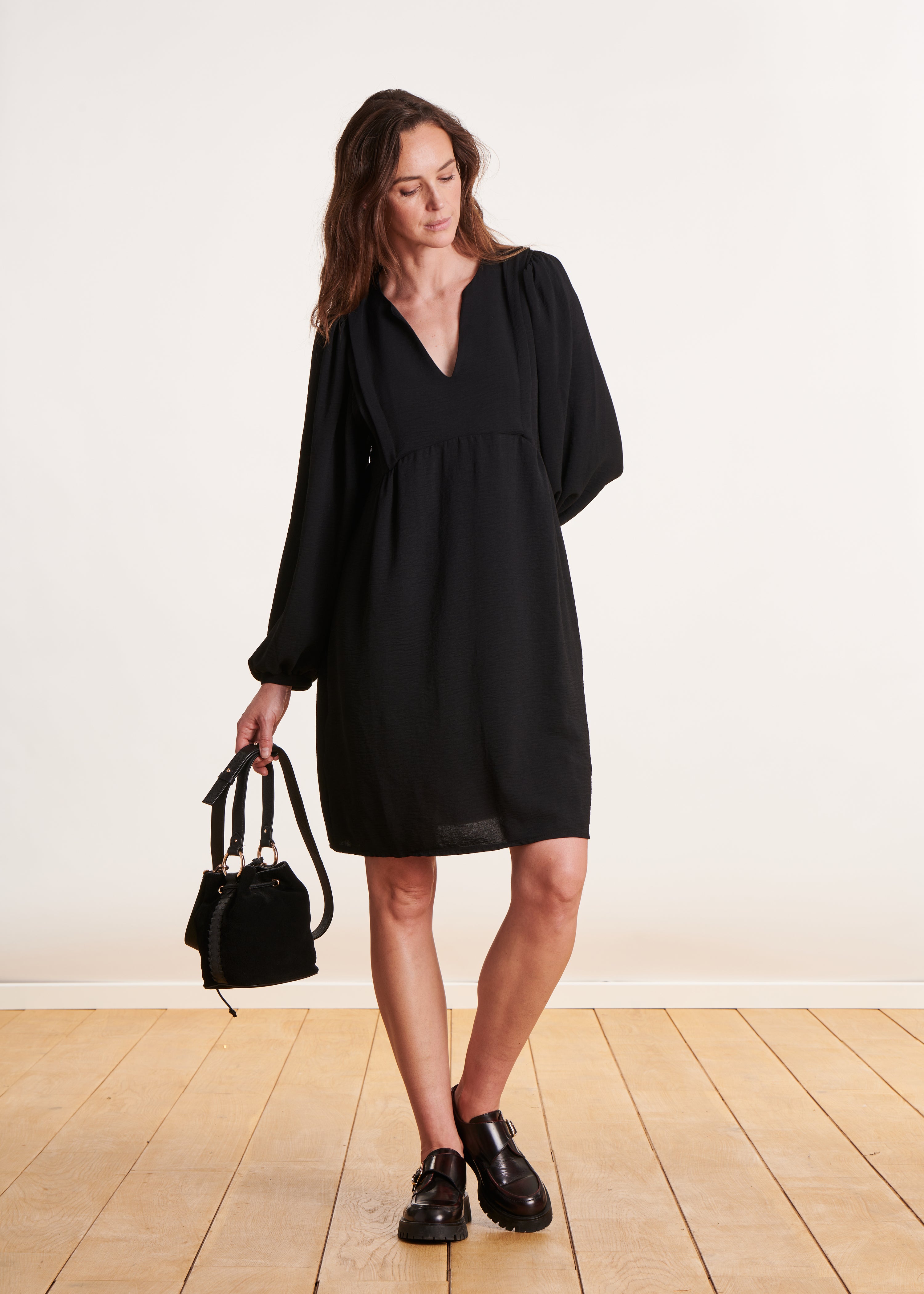 Short, loose-fitting black dress