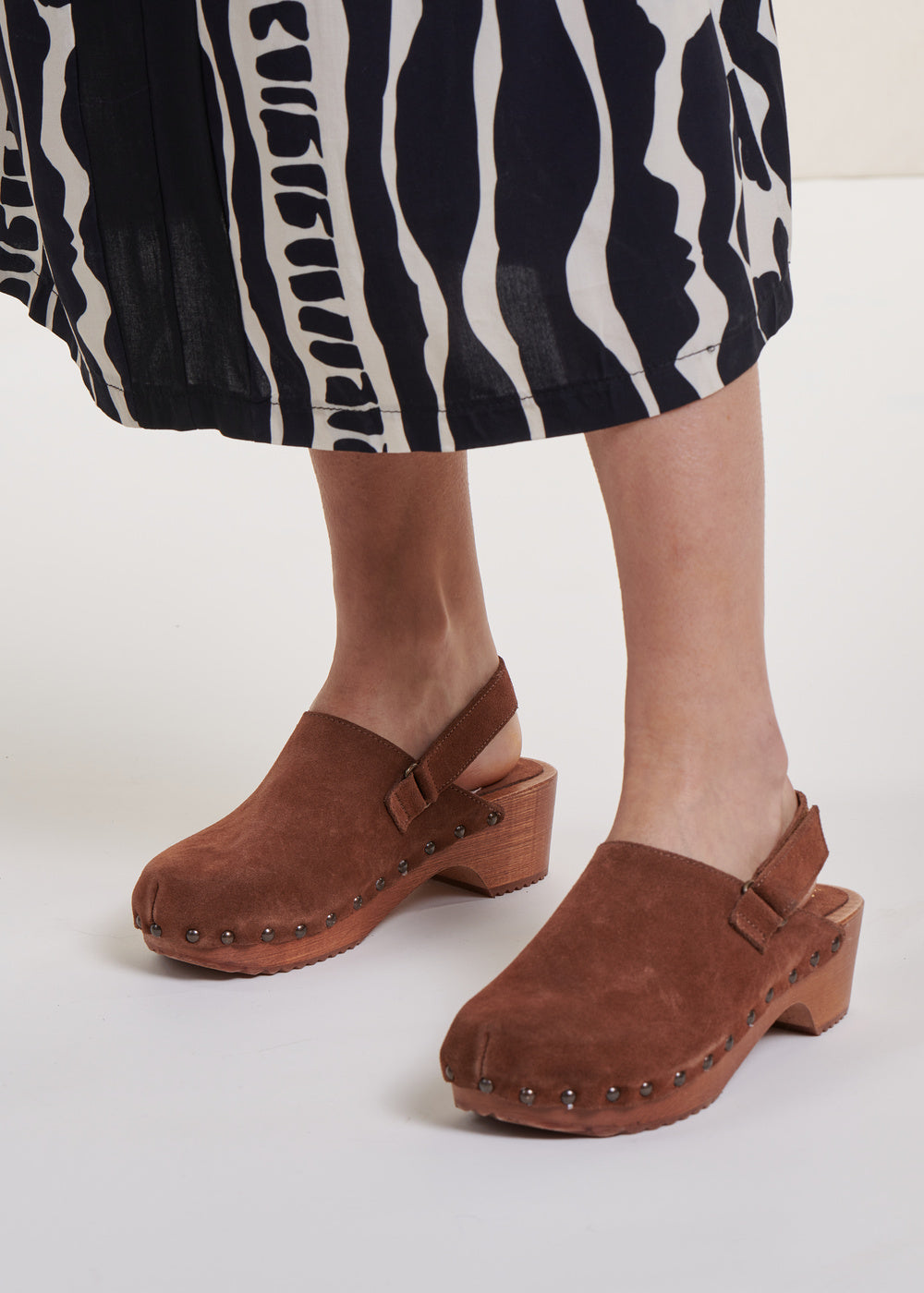 Wooden clogs with back strap