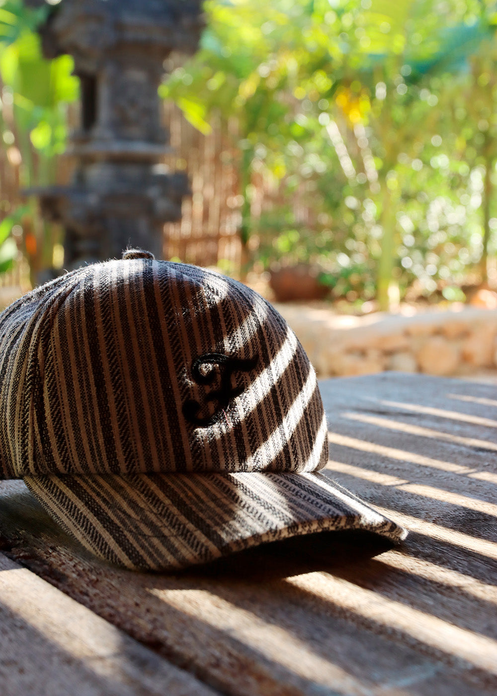 Striped cap with black embroidery