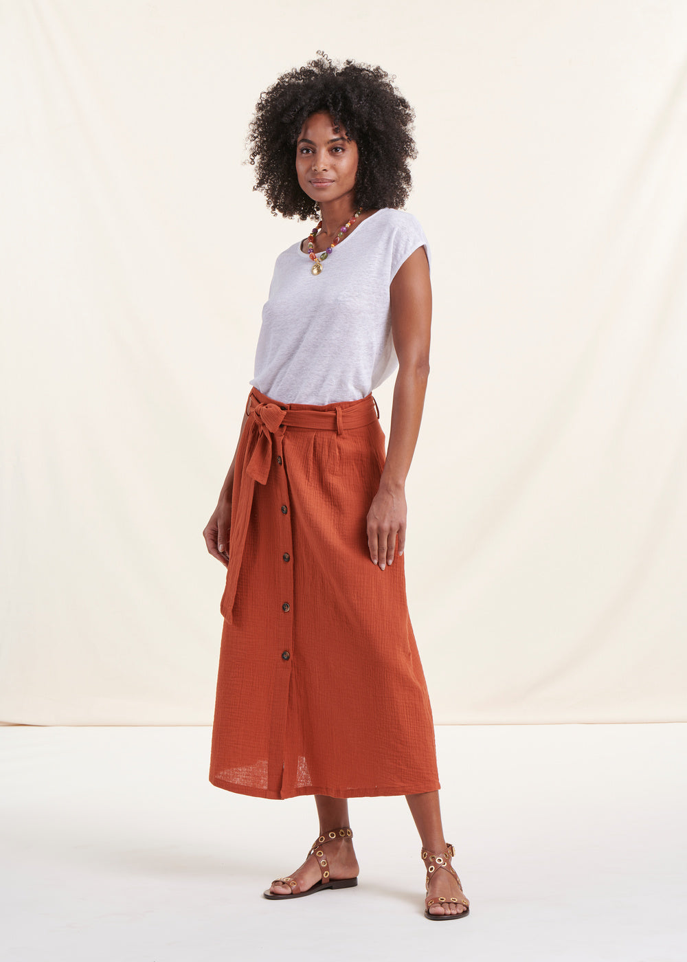 Orange buttoned cotton mid-length skirt