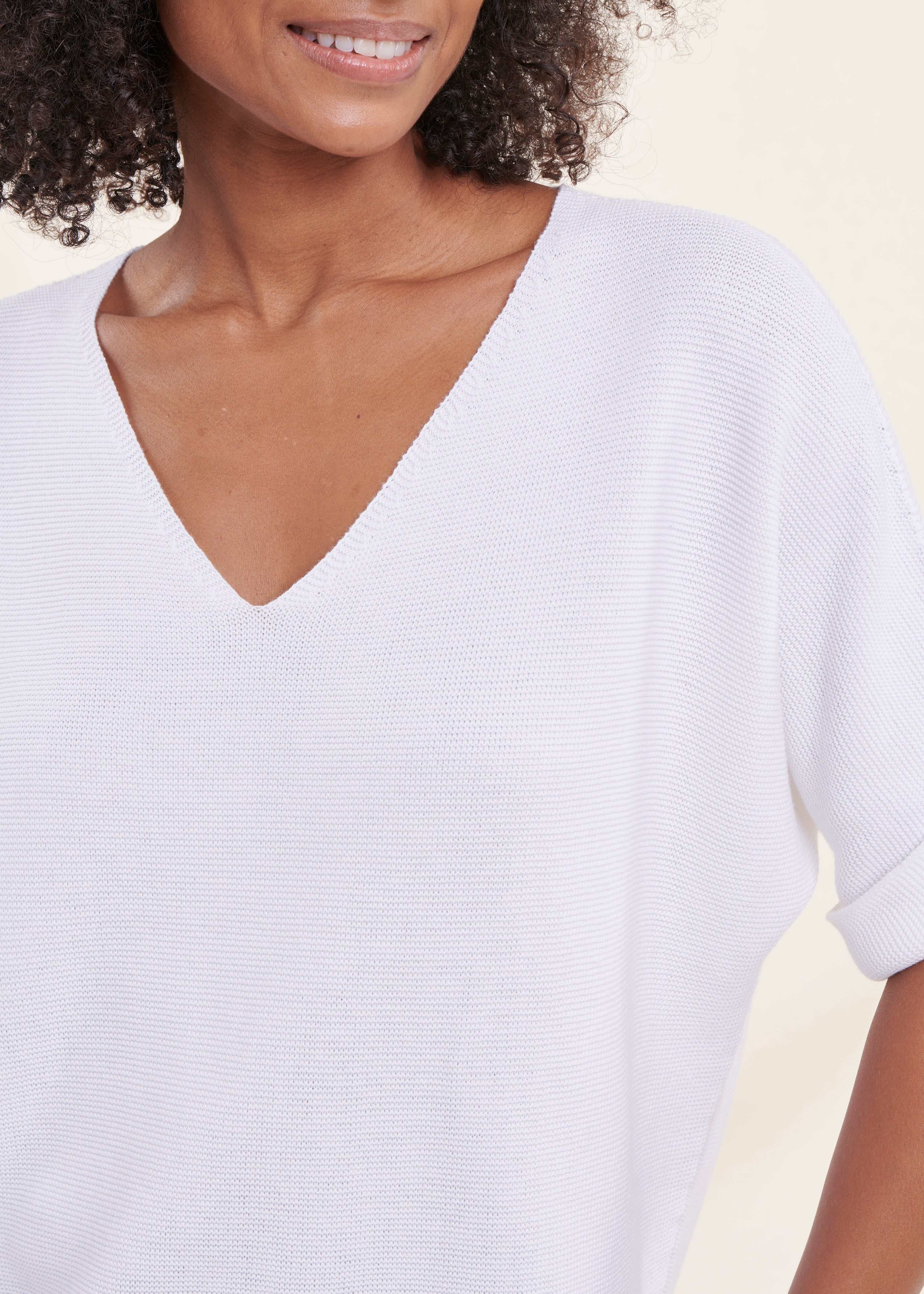 White short-sleeved V-neck sweater