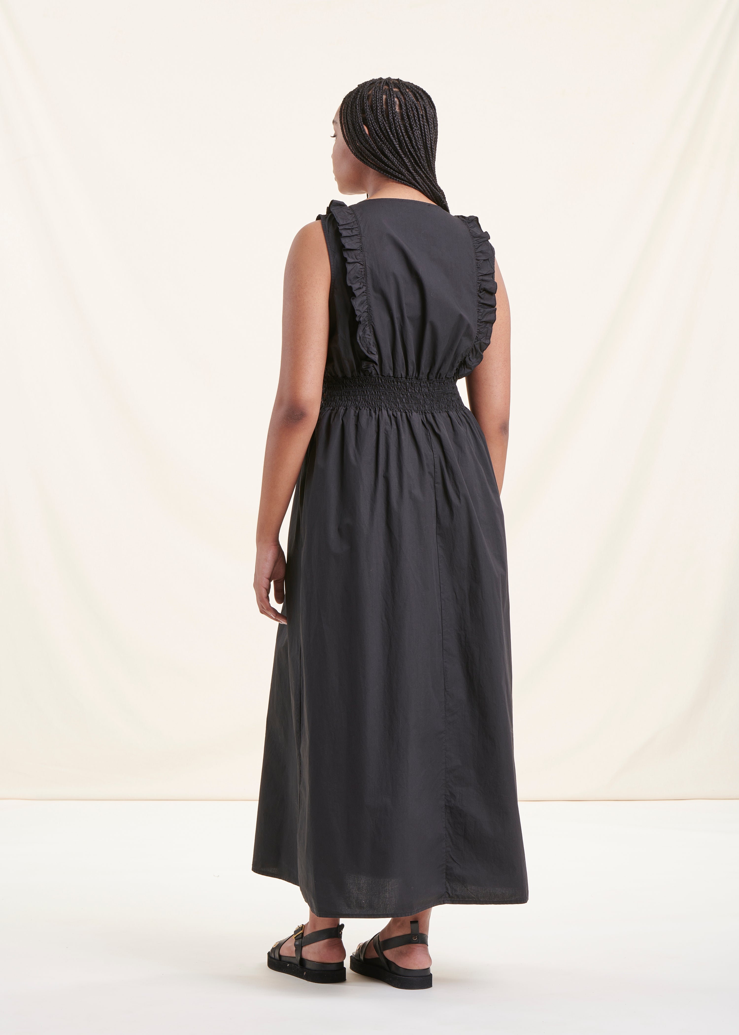 Long black sleeveless cotton dress with lace