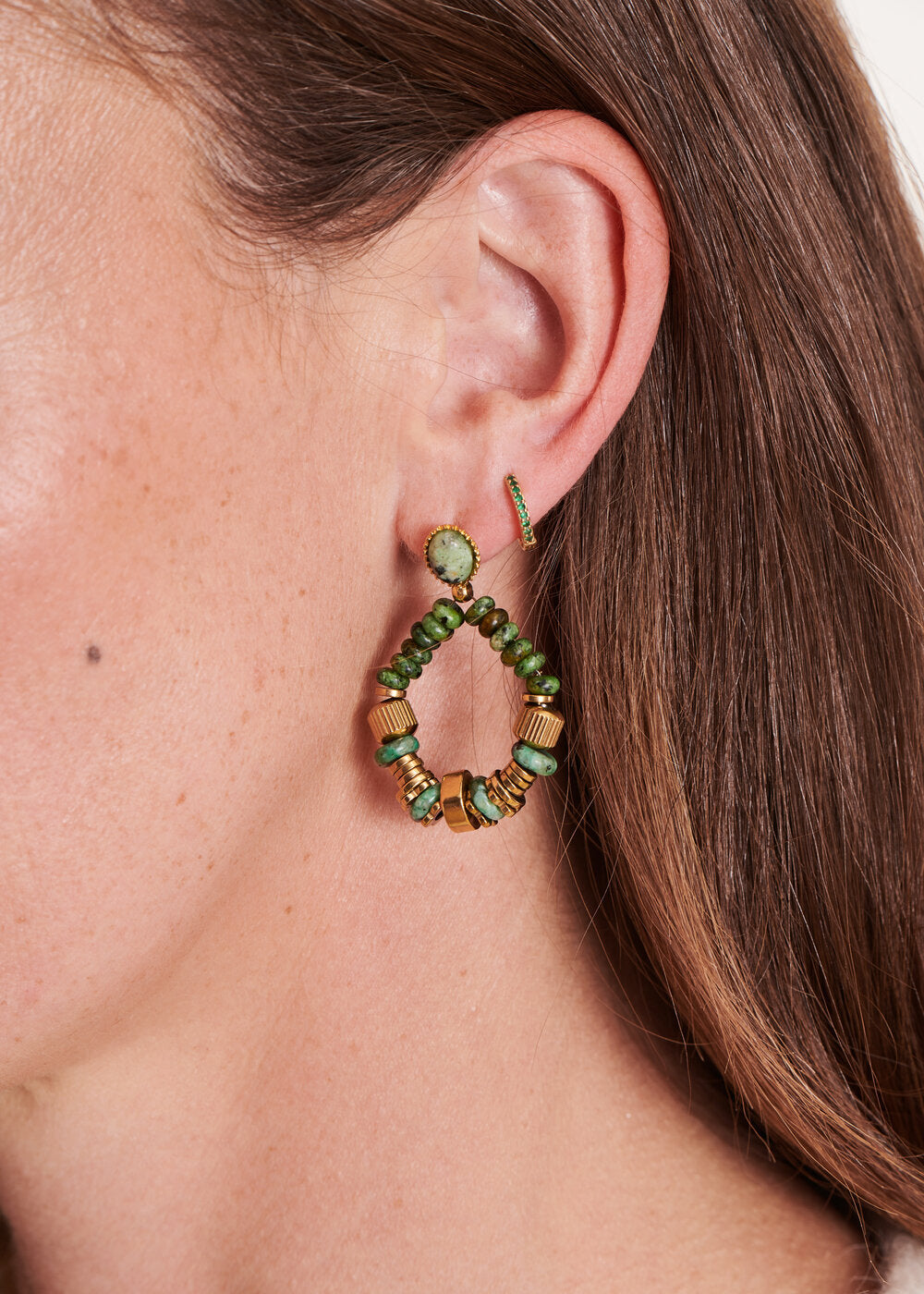 Green beaded hoop earrings