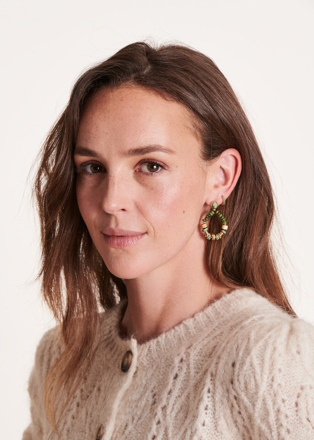 Green beaded hoop earrings