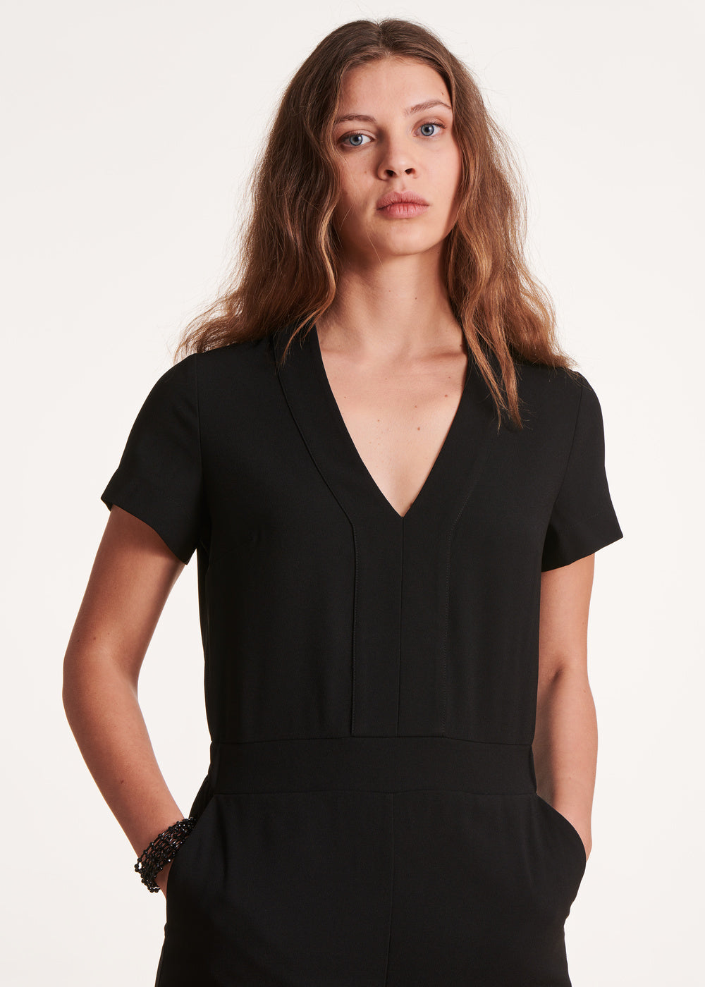 Black fitted jumpsuit with V-neck