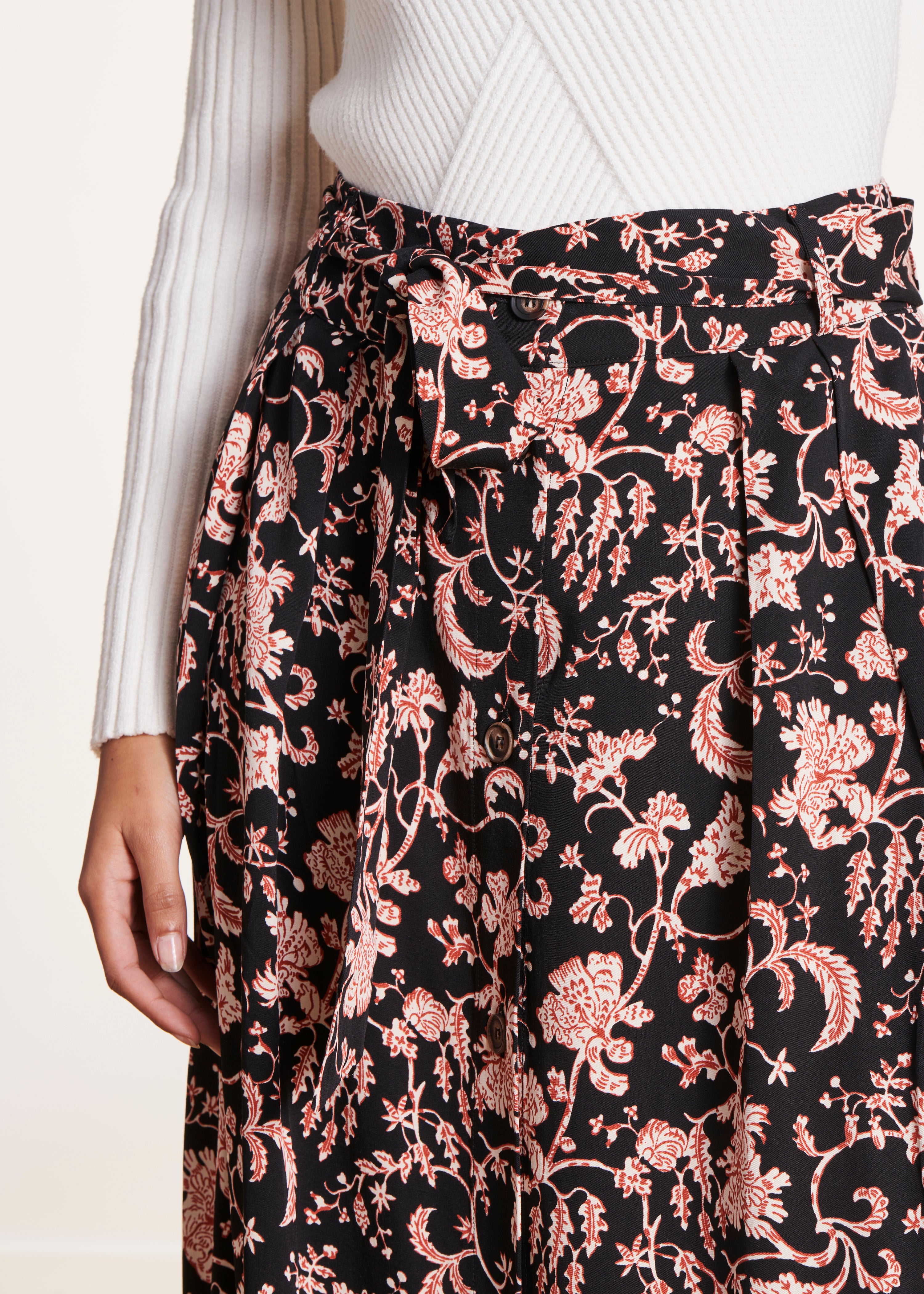 Black buttoned midi-length skirt in printed voile