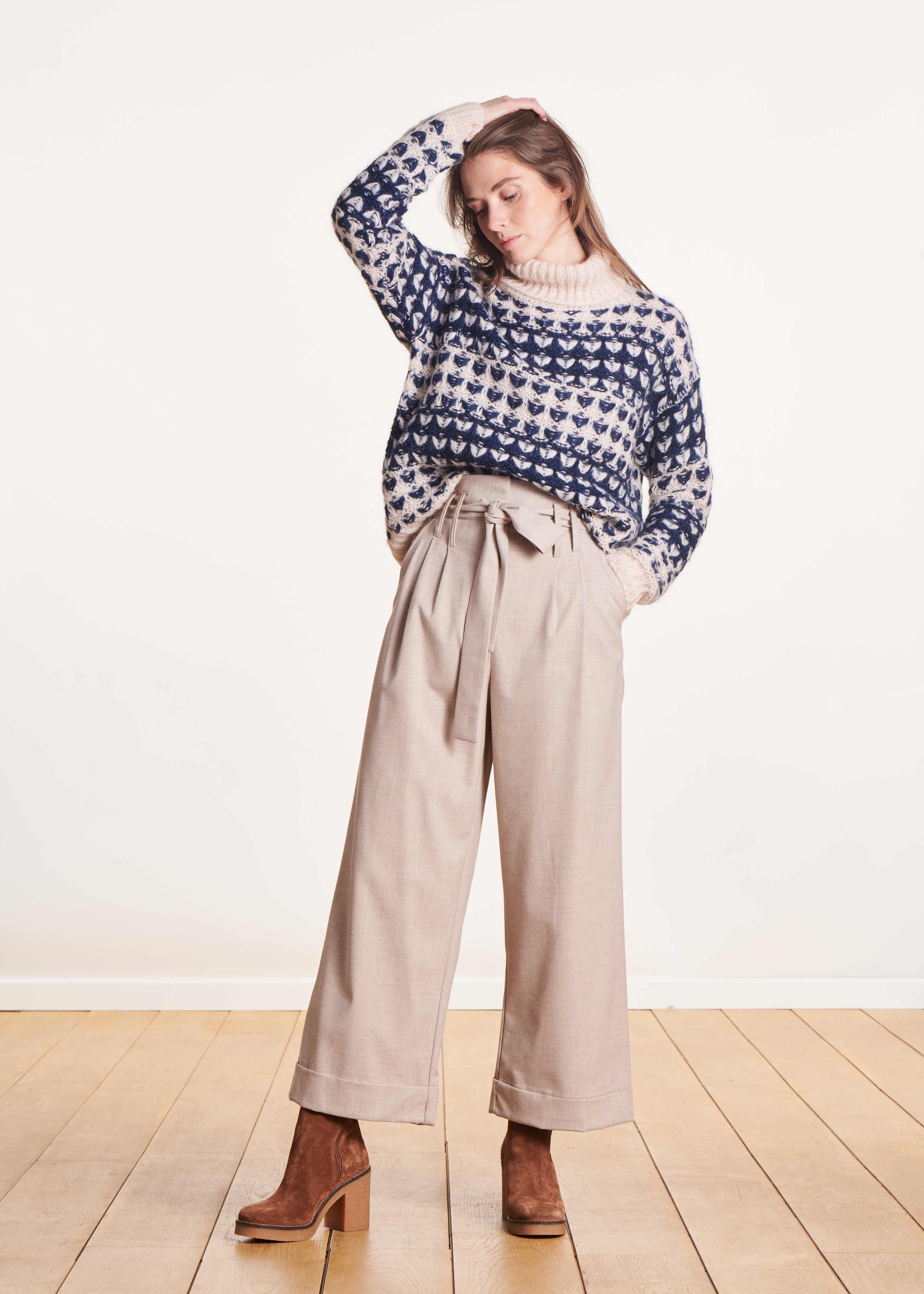 Beige high-waisted wide-leg pants with tie belt