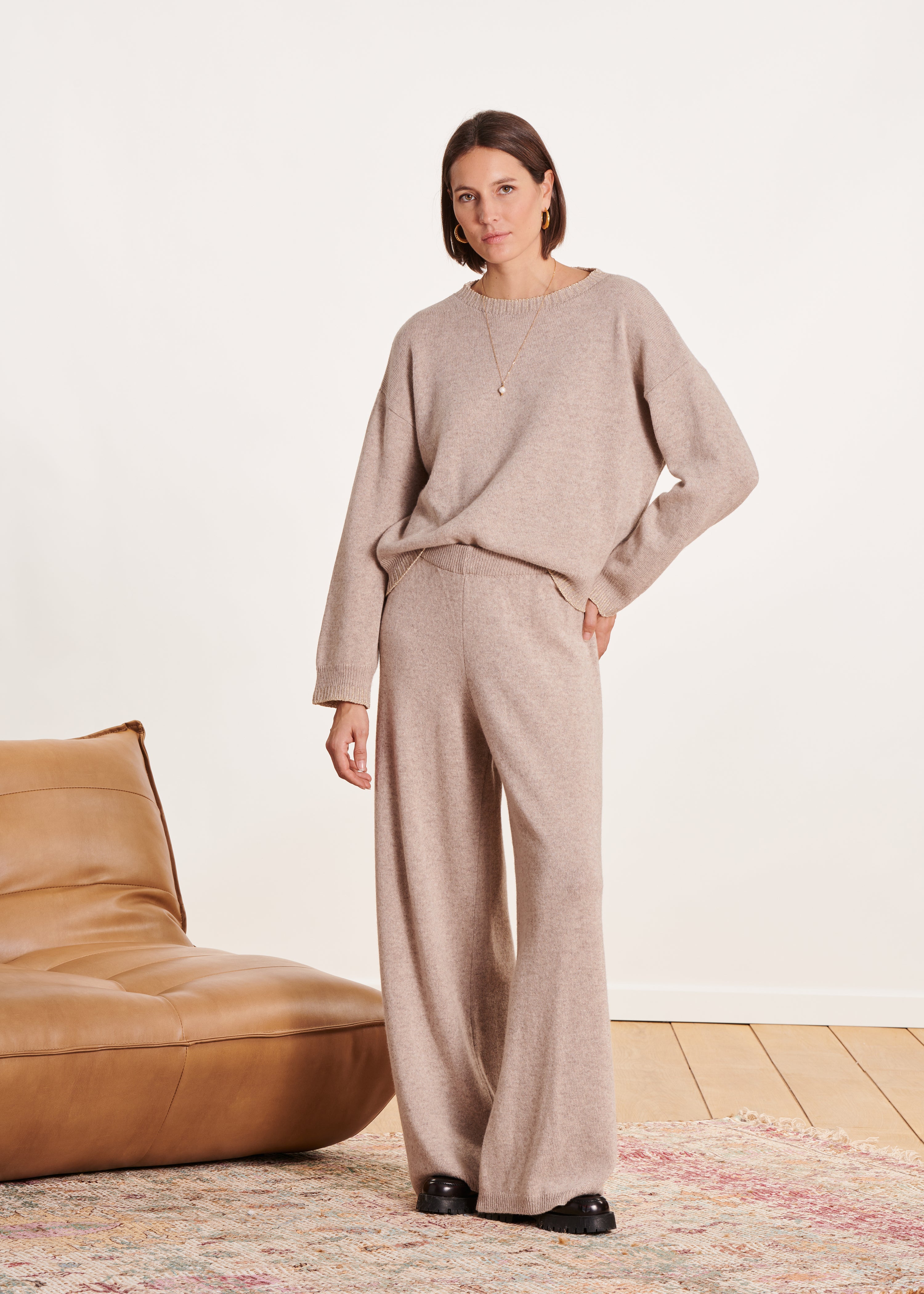 Beige loose-fitting knitted trousers with elastic waistband