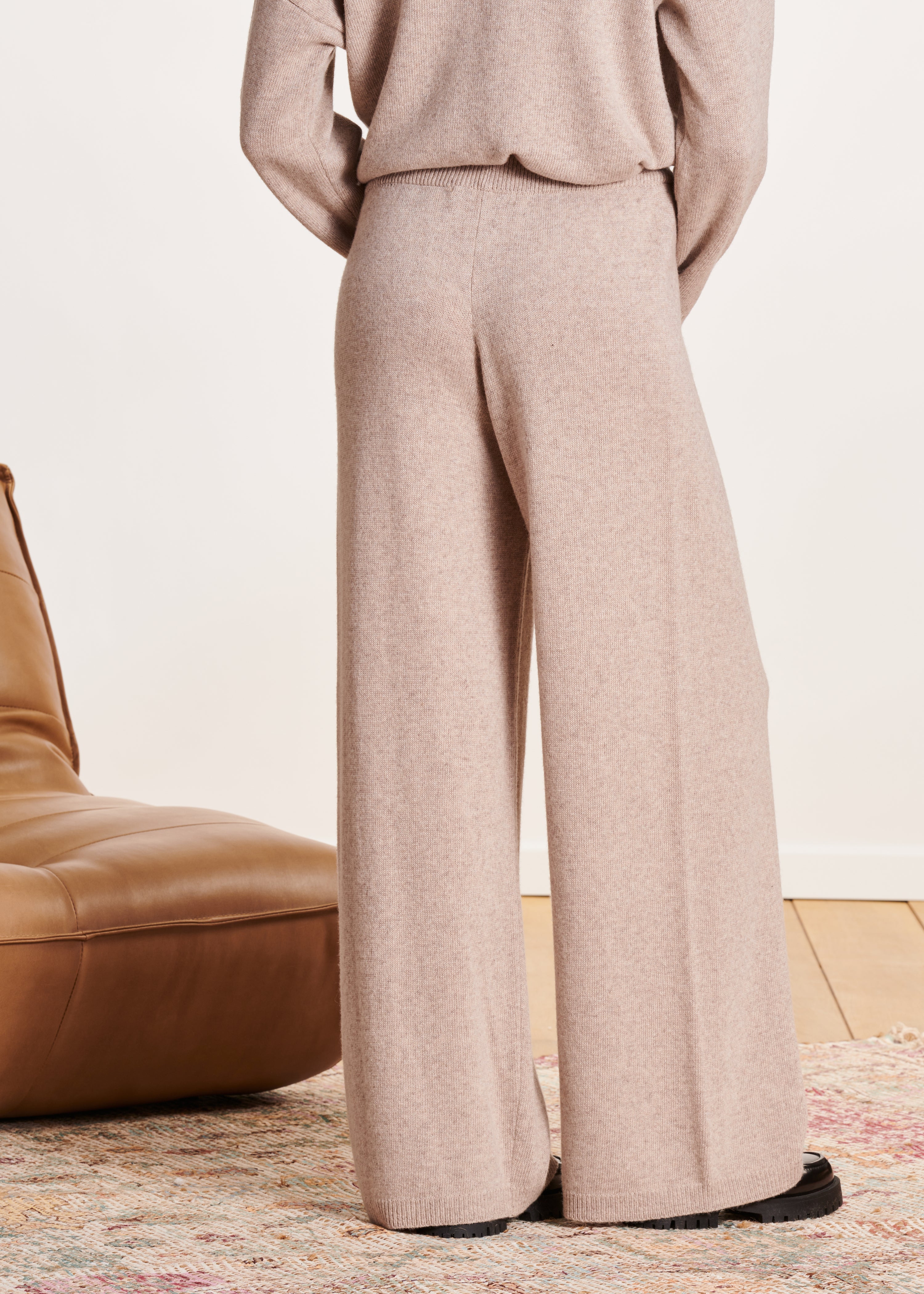 Beige loose-fitting knitted trousers with elastic waistband