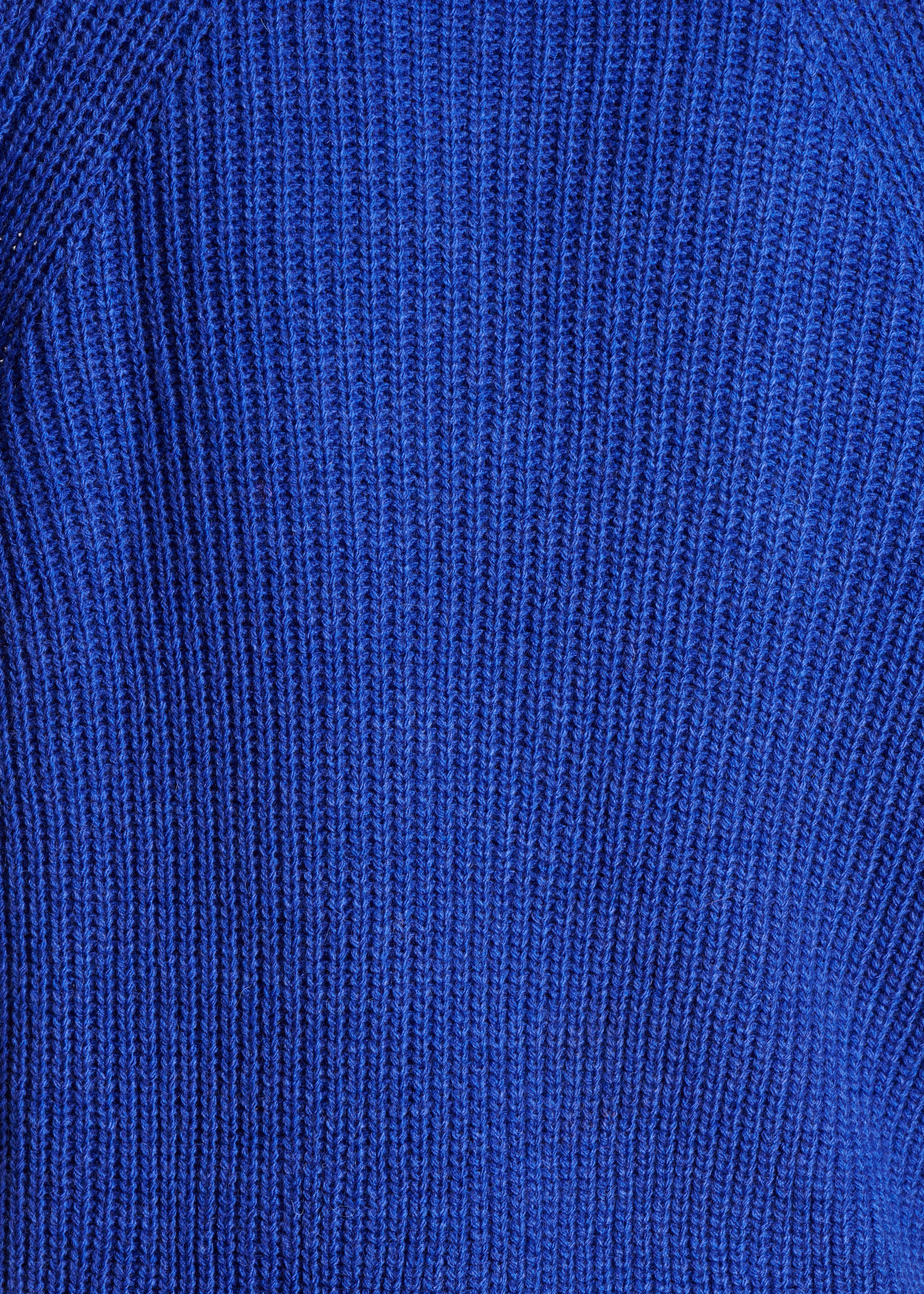 Loose blue sweater with ball neck in pearl ribbing