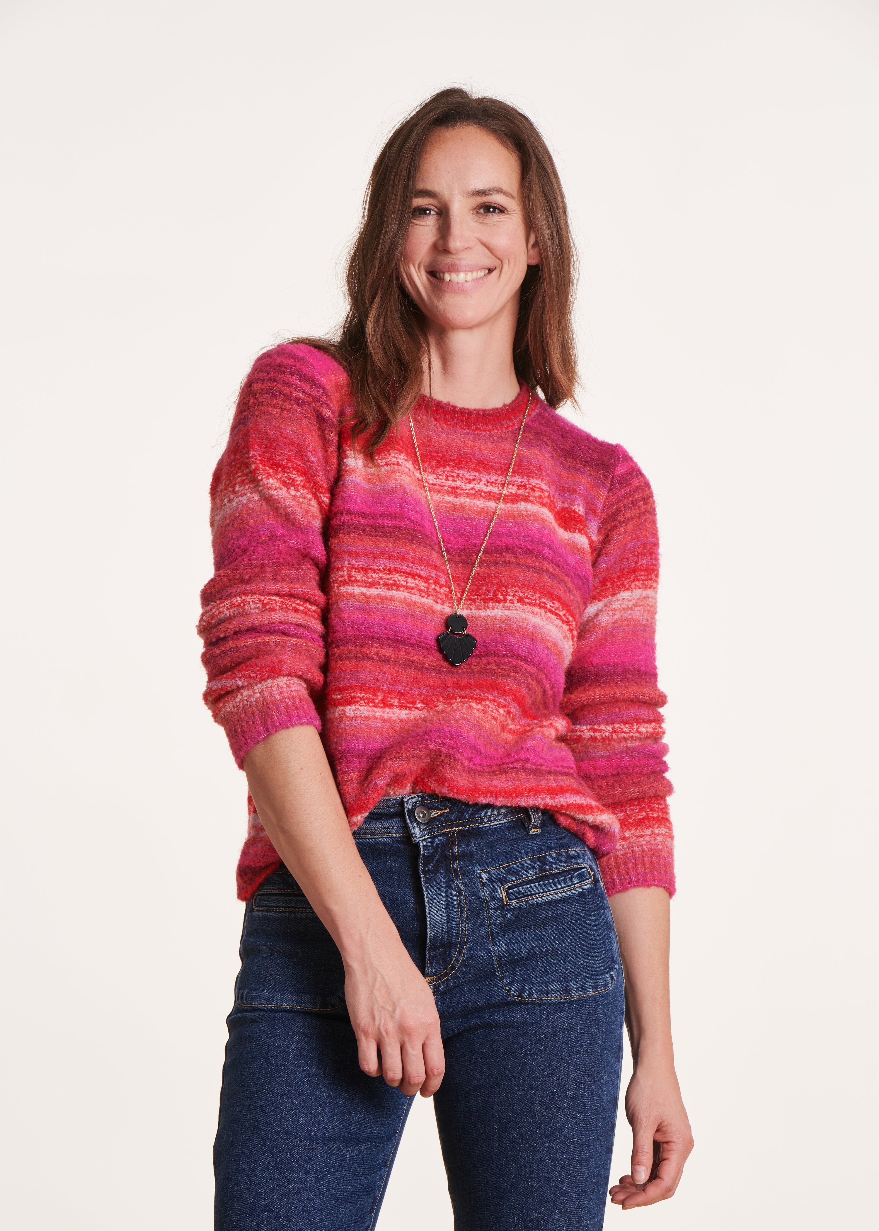 Pink sweater with multi-colored stripes