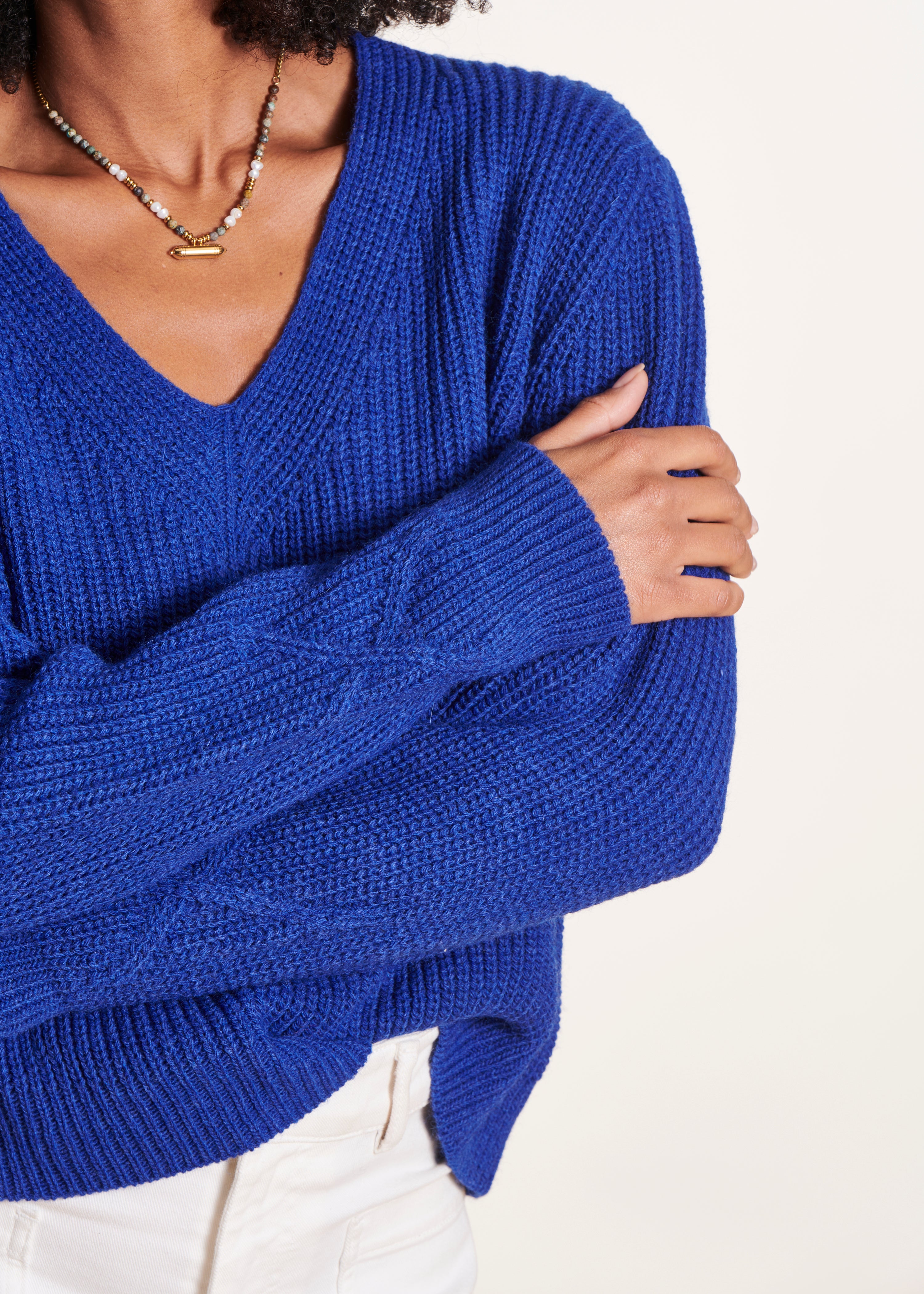 Short blue V-neck sweater