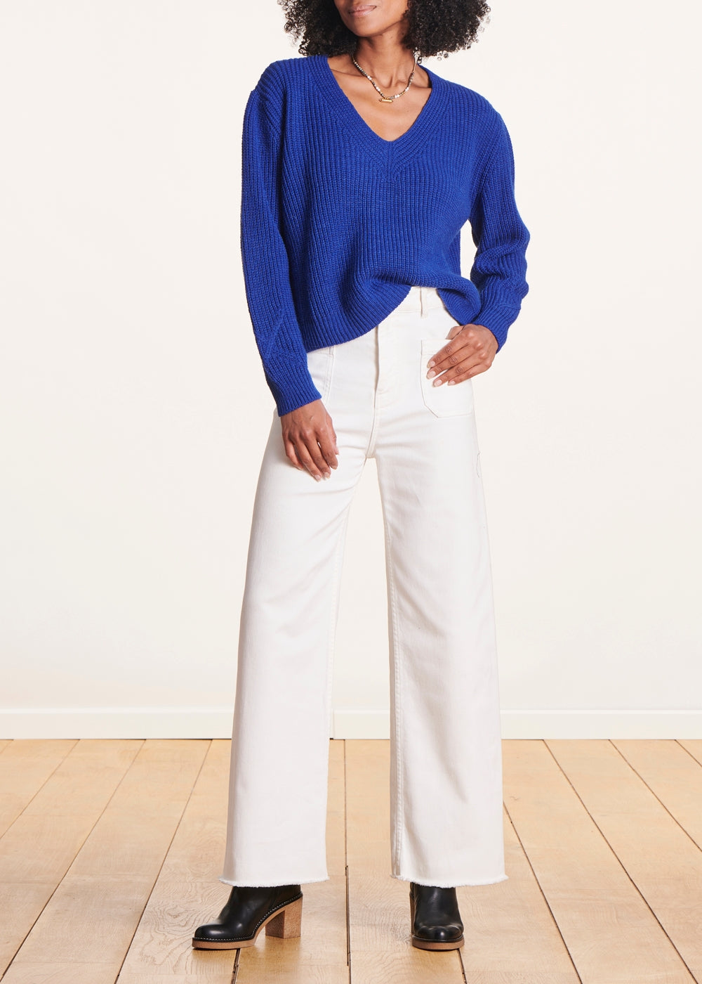 Short blue V-neck sweater