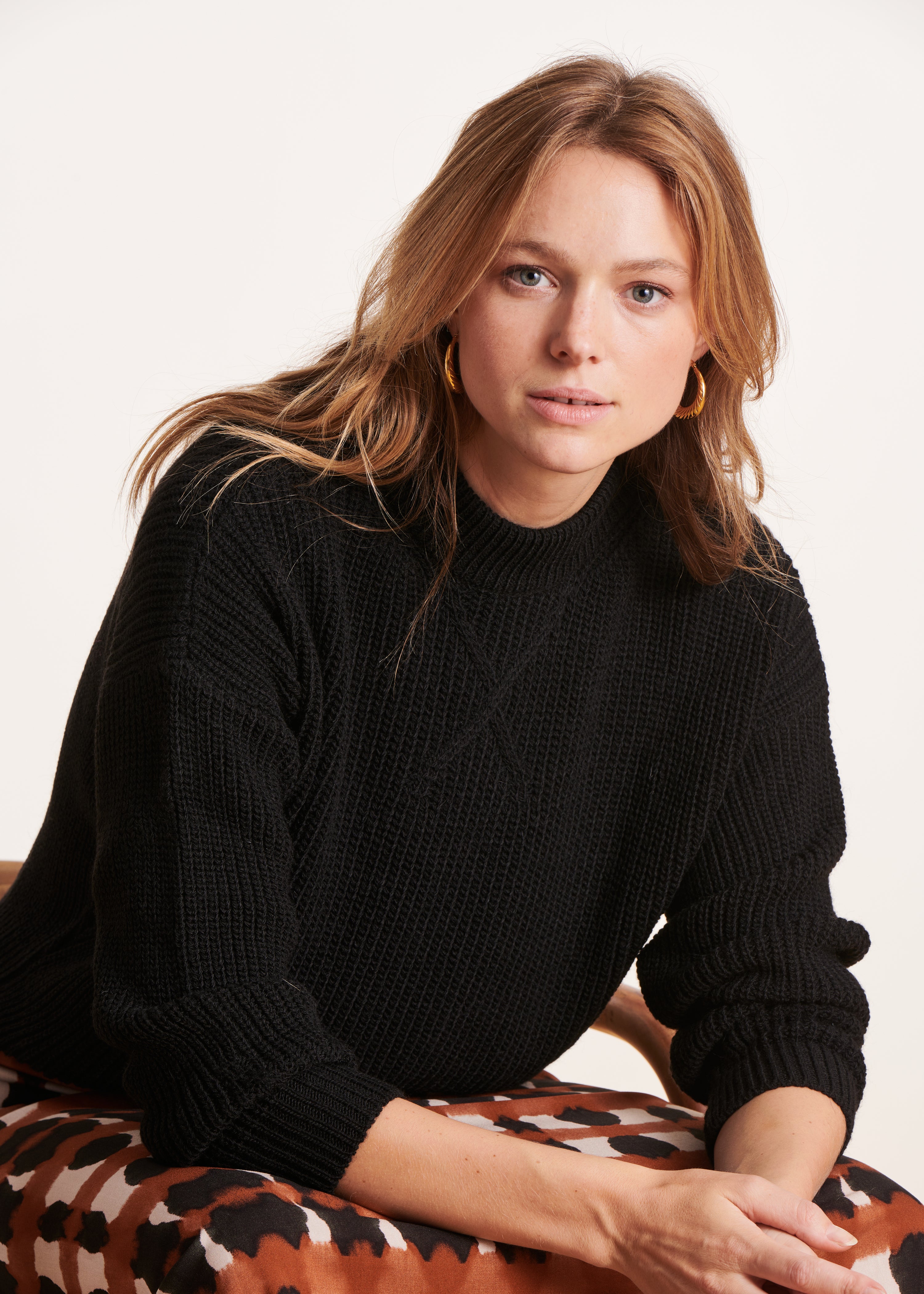 black high-neck sweater in beaded rib knit