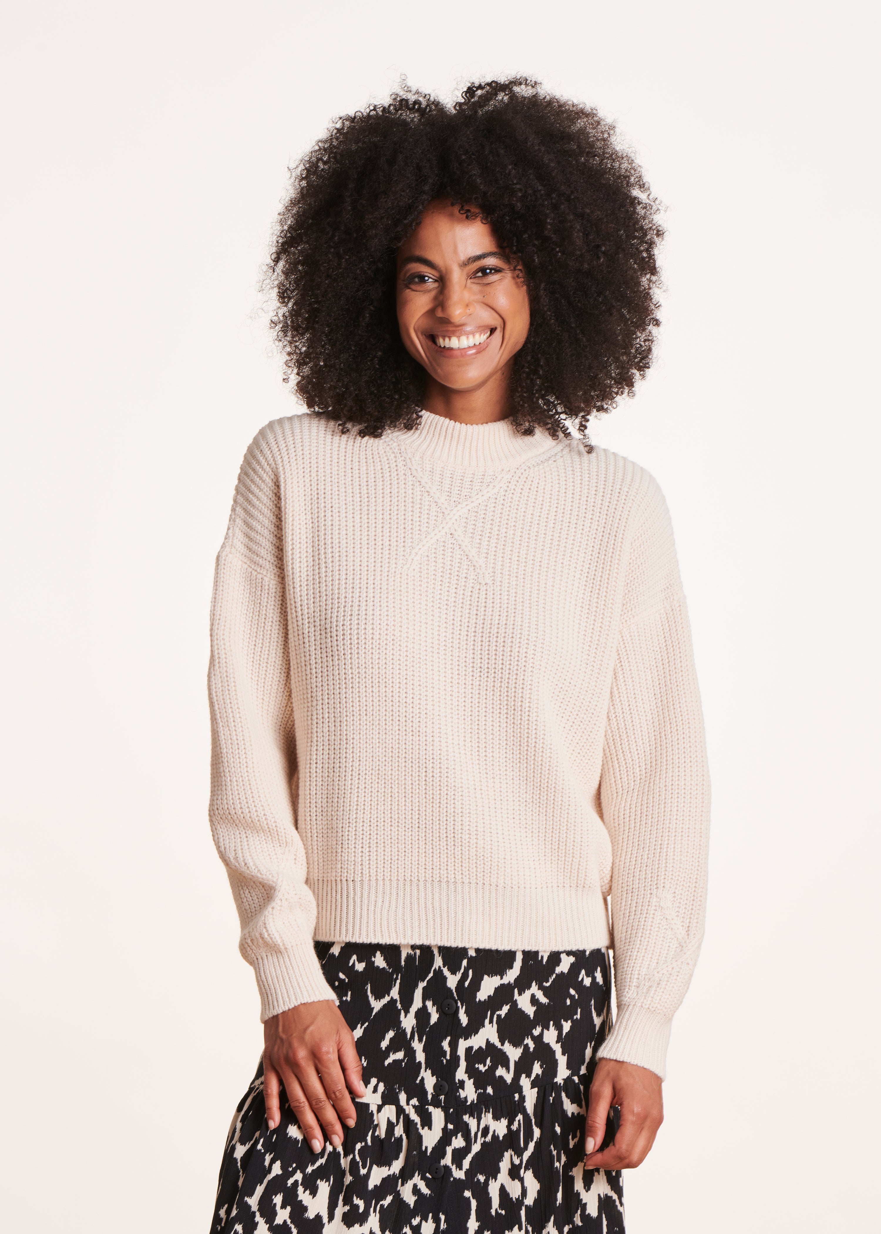 Ecru sweater with high collar in beaded rib knit